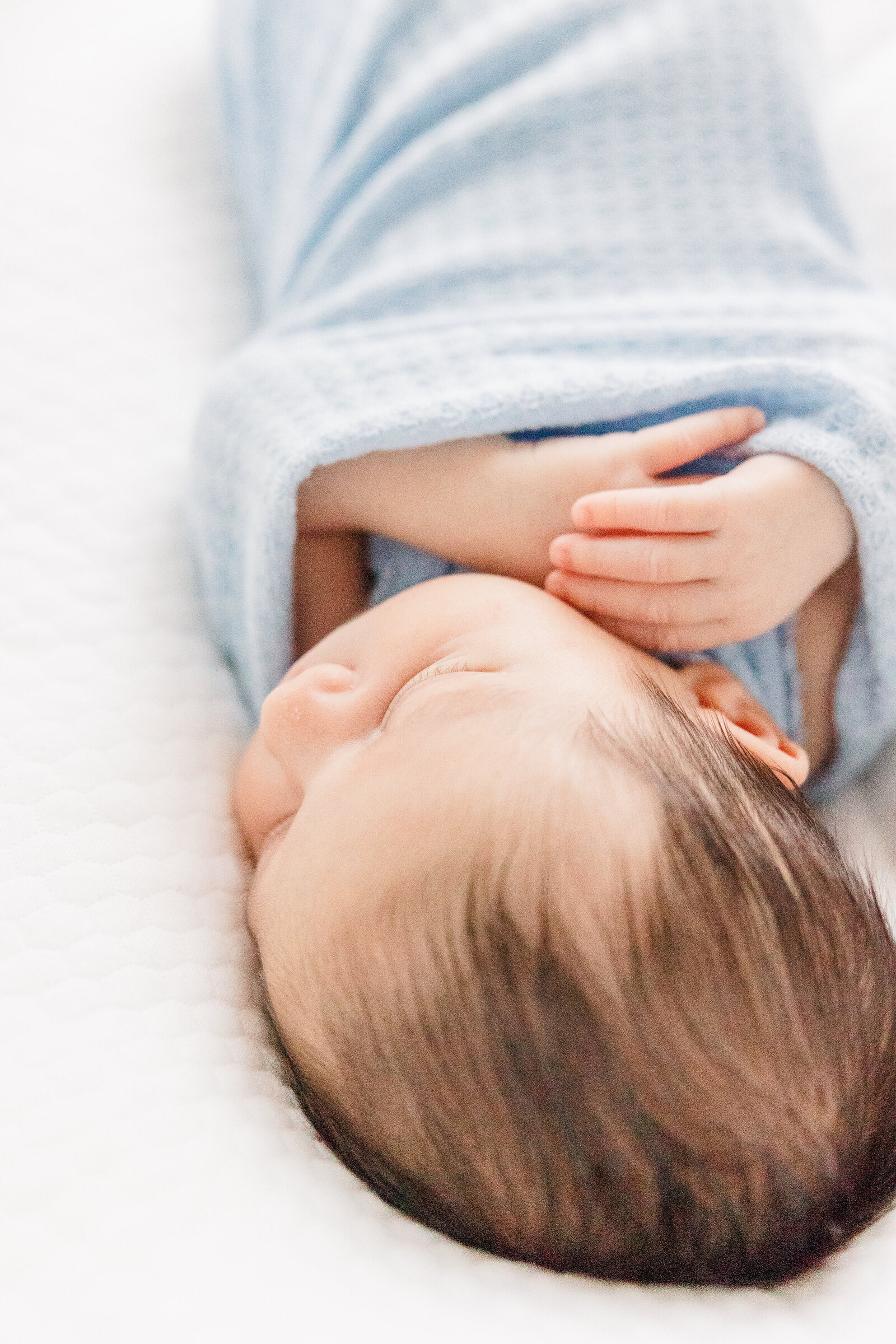 Akron newborn photographer light and airy baby boy asleep in bassinet