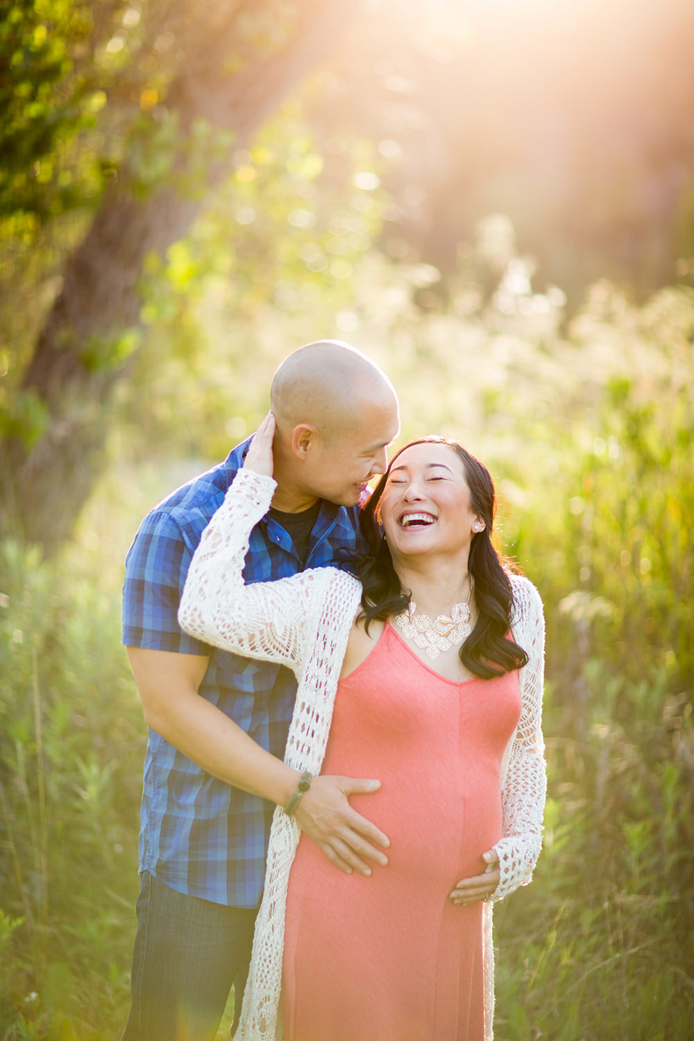 Happy couple in a field in San Diego.