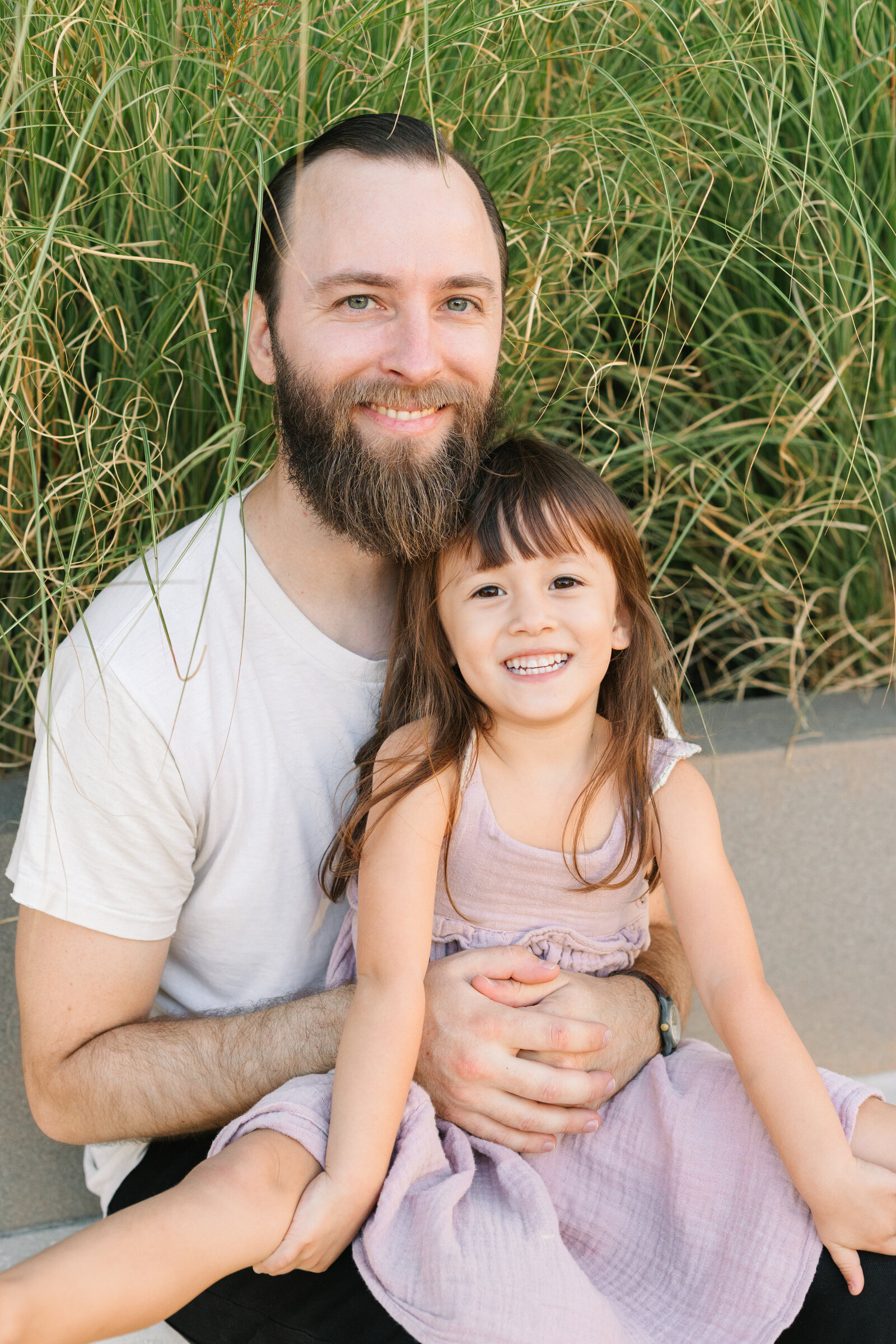 A family poses for photos in a forest in Los Angeles, Ca.