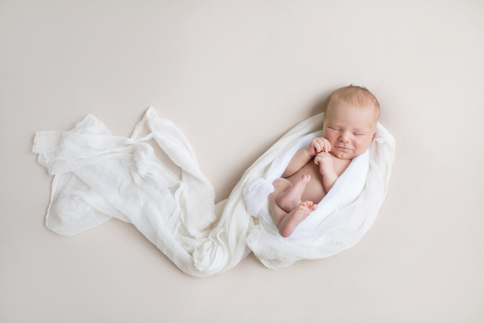 newborn_baby_wrapped_in_white