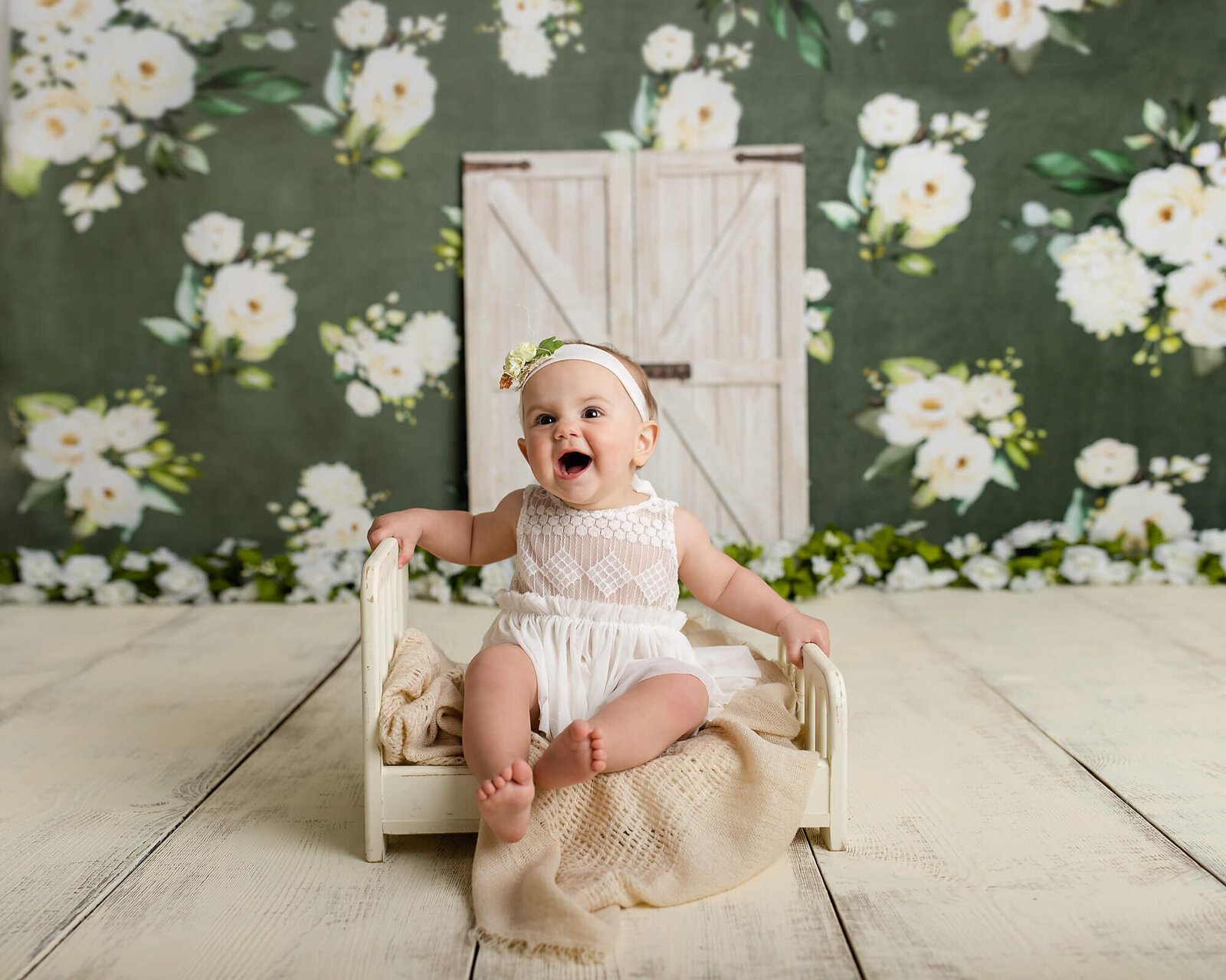 Baby girl sitting on bed smiling, Blue grass baby photographer, Baby photos Blue Grass, Blue Grass baby photography