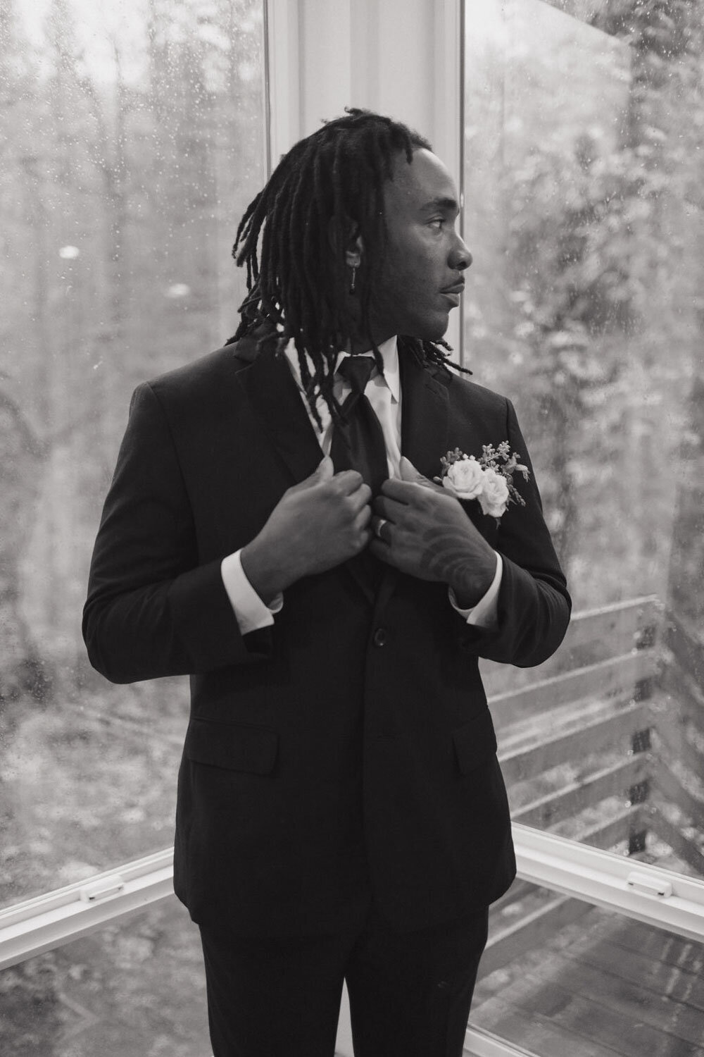 Groom standing outdoors