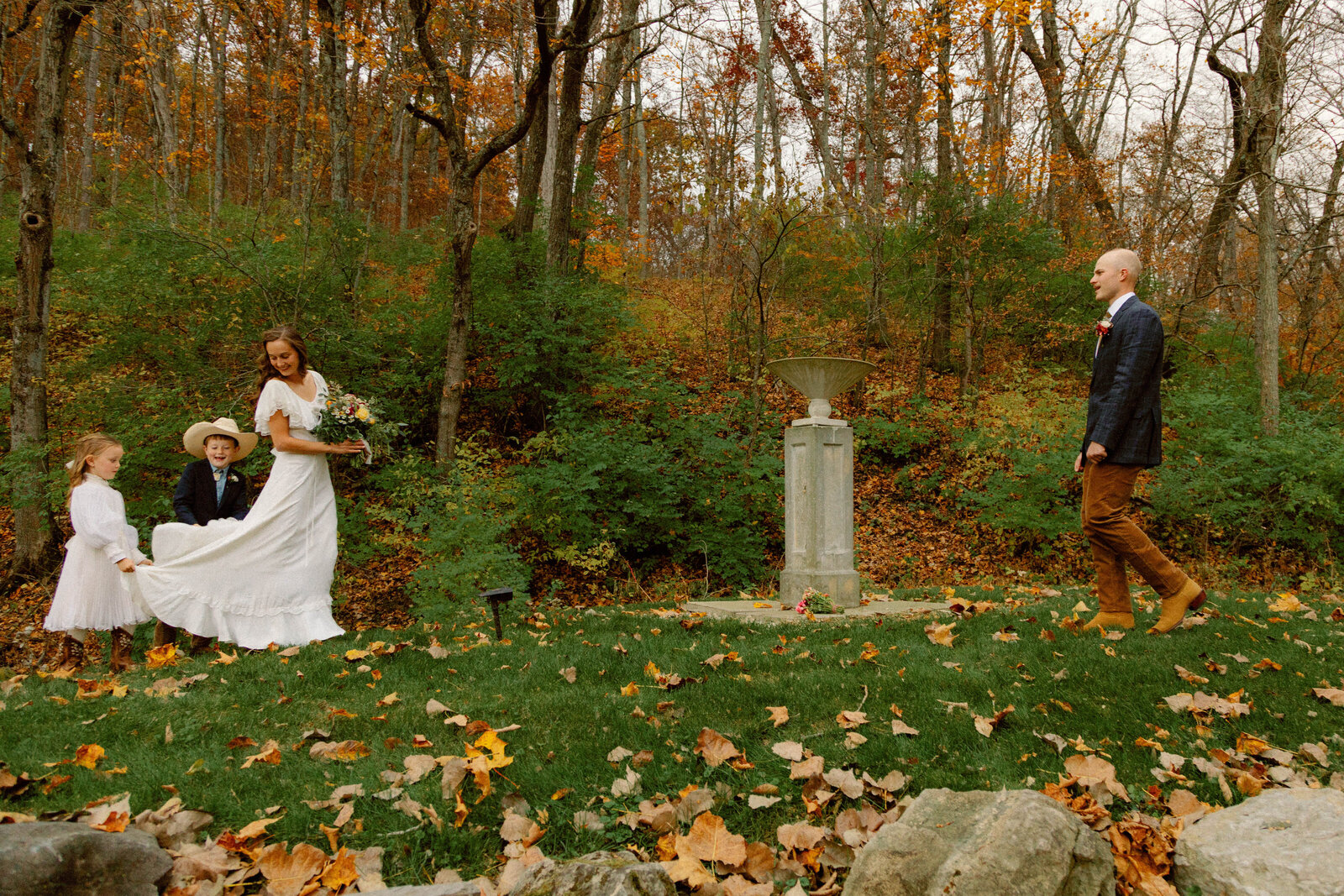 landscape shot of elopement in columbia missouri in tall grassy field with bright blue skies.