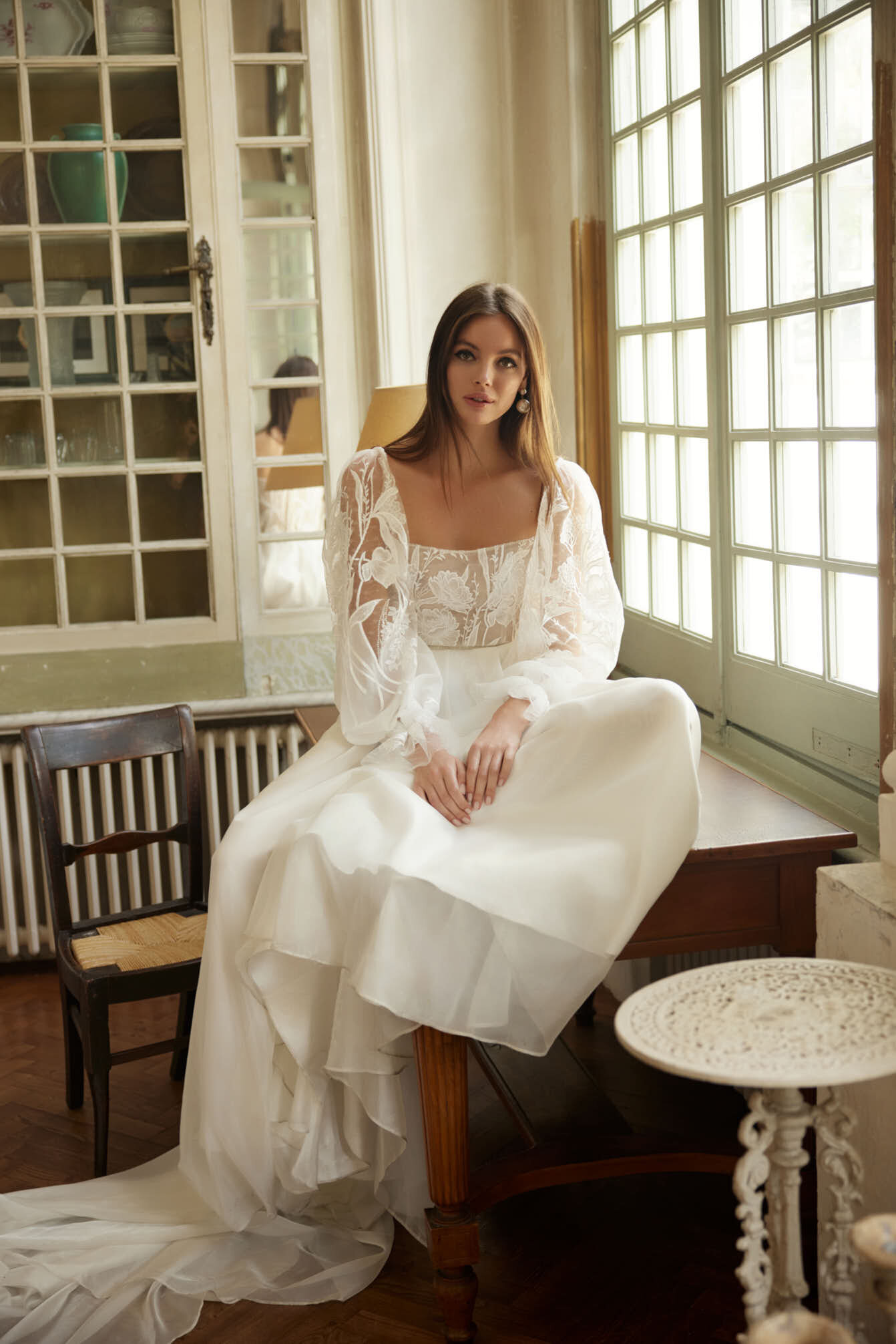 bride wearing lace wedding dress with long sleeves