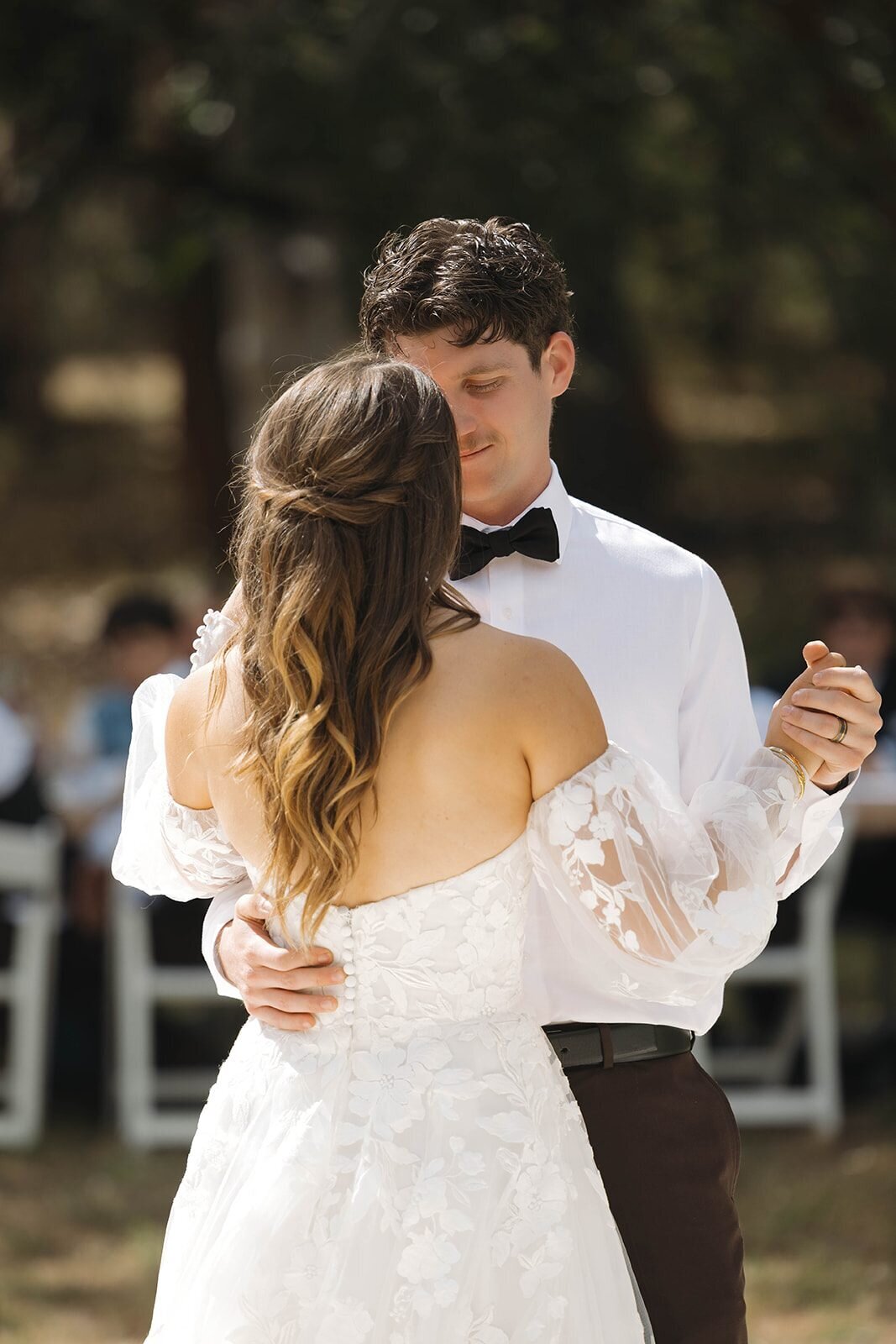 Bride and groom's first dance under the trees