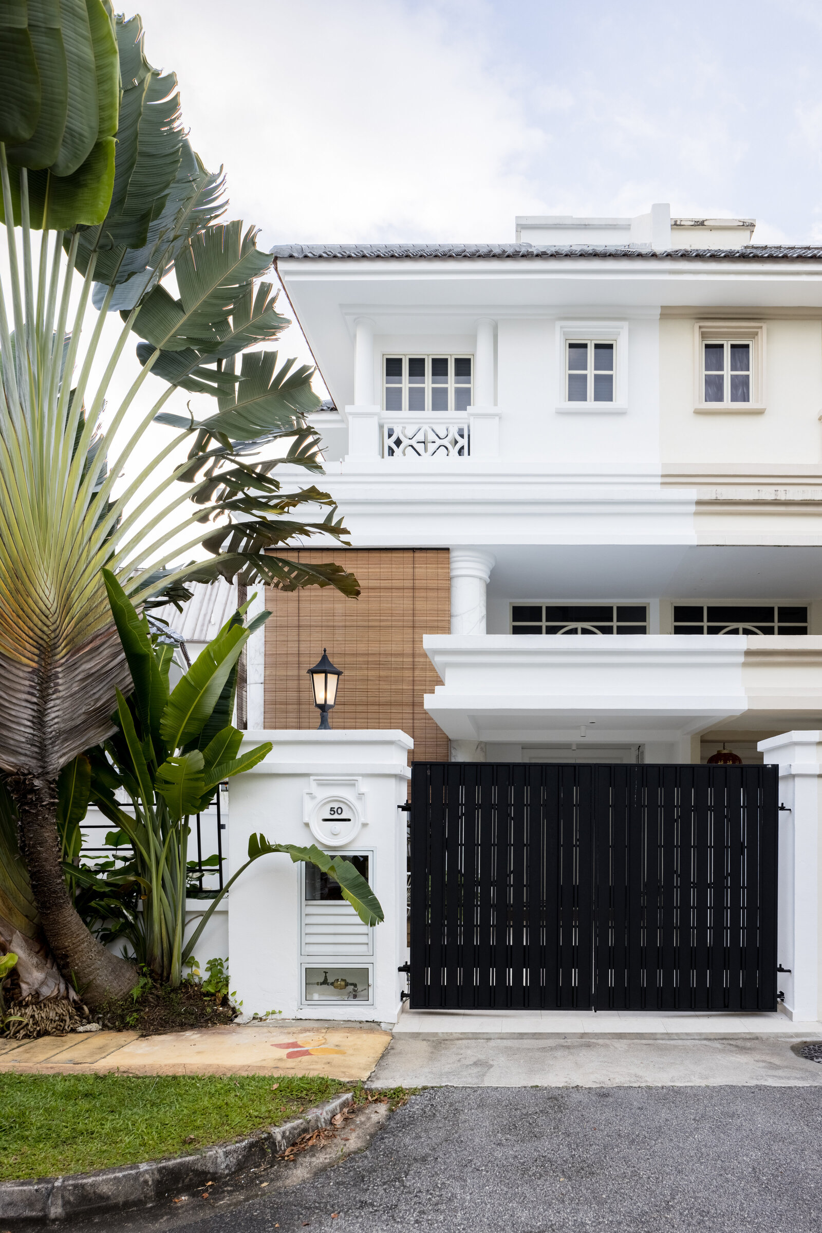 Front of house view with black gate