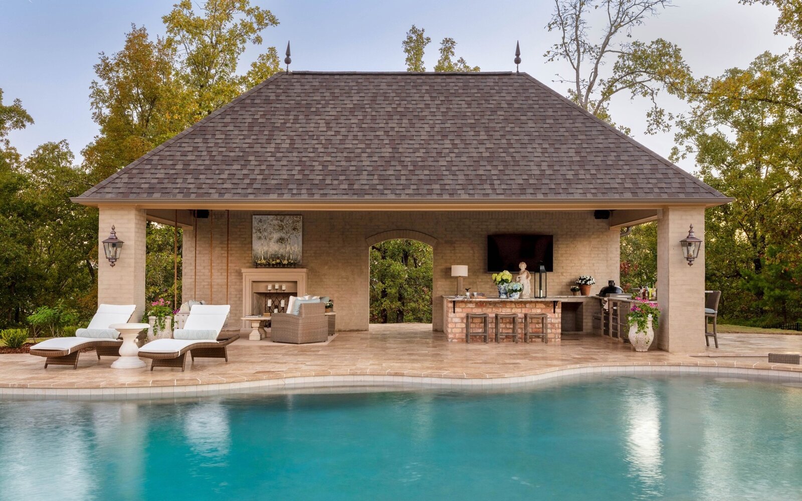 outdoor-pool-bar-fireplace-arkansas-backyard-retreat