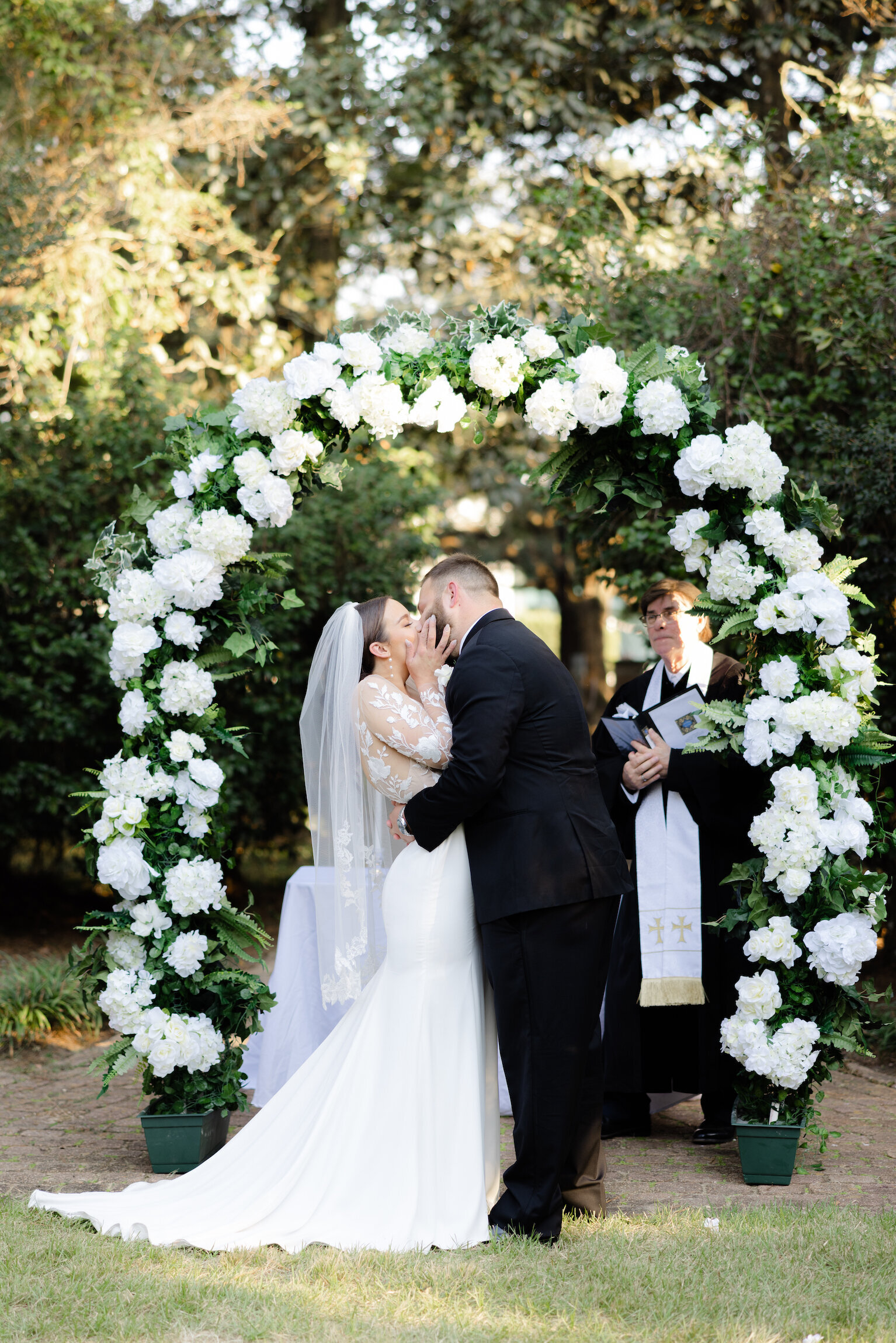 Bride and groom celebrating their wedding at the UL Alumni Center, captured in timeless detail on film by Morgan Alysse, Louisiana film photographer.