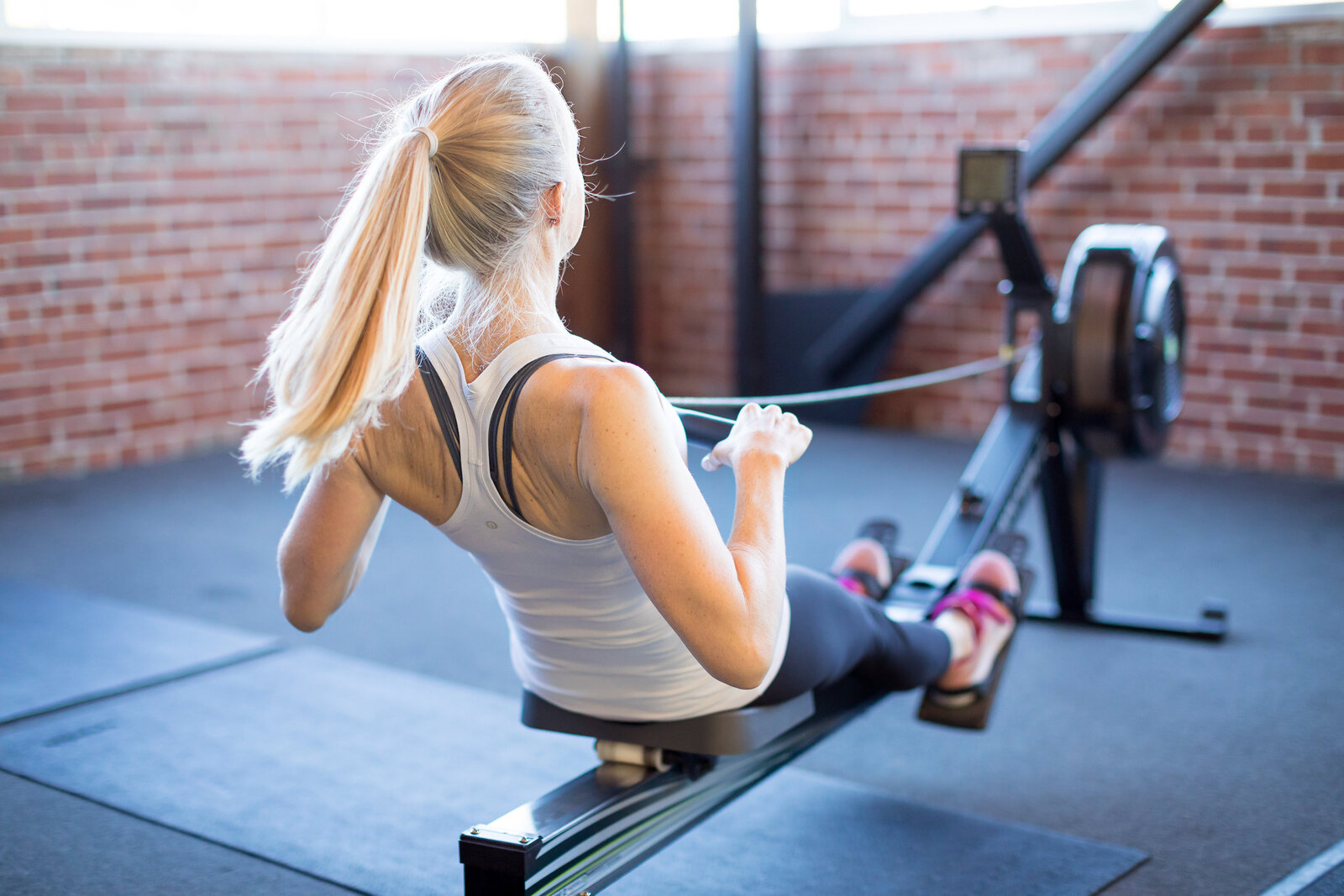 Kristin Hedstrom, an Olympian and erg coach, rowing on the Concept2 rowing machine.