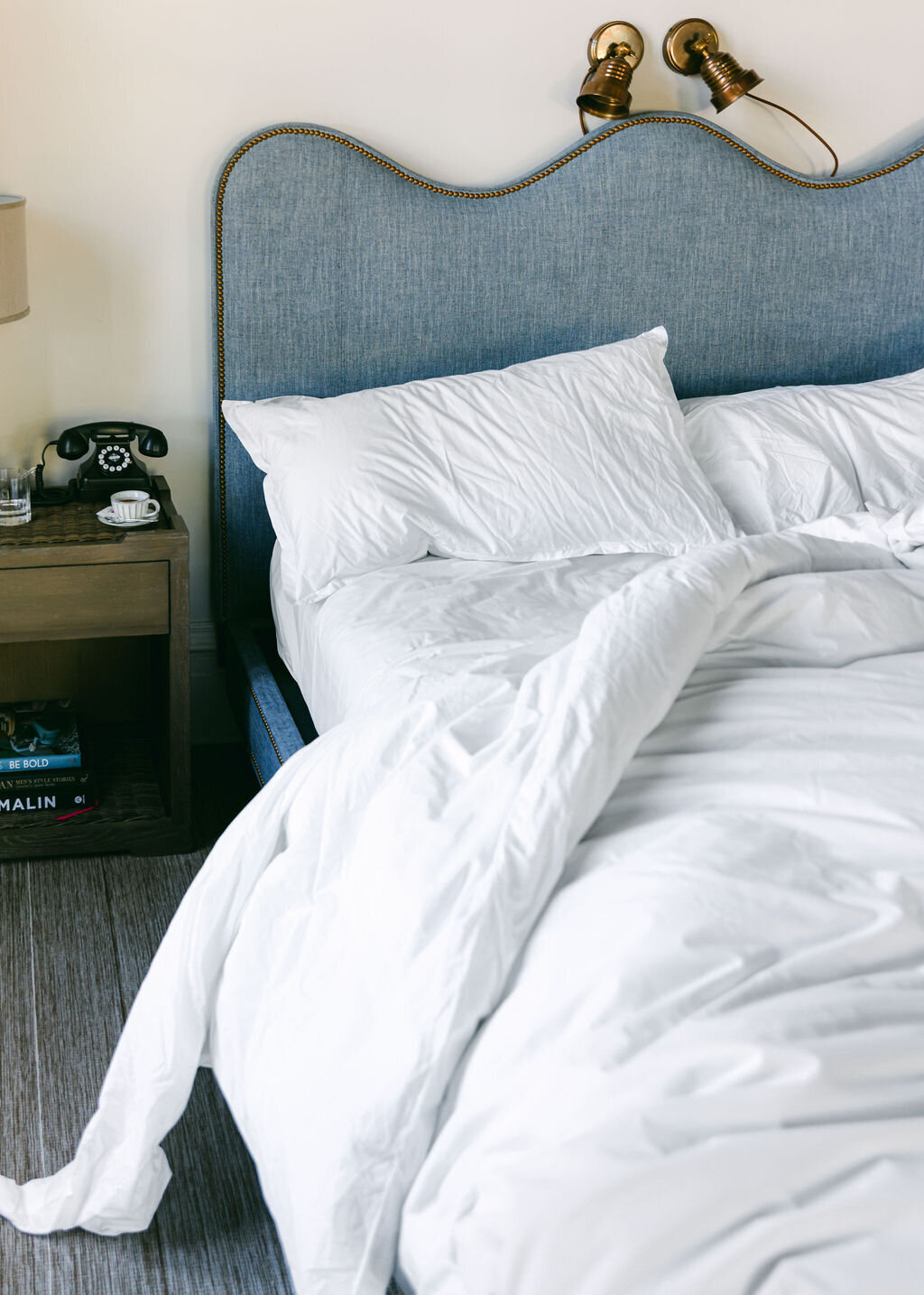 messy bed at luxury boutique hotel designer