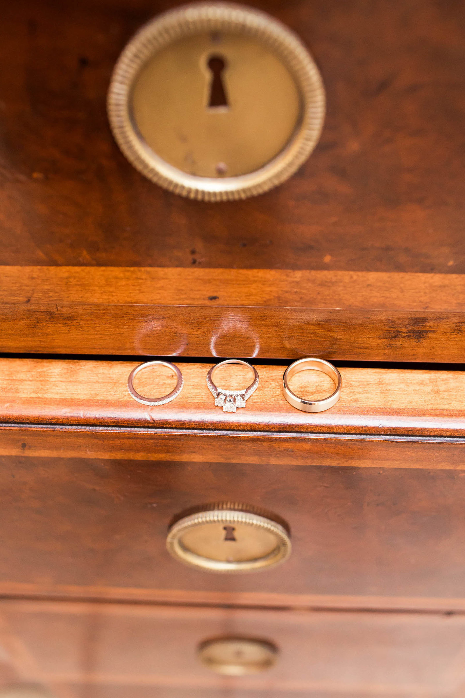 Rings lay on wooden chest drawer, Daniel Island Club, Charleston, South Carolina