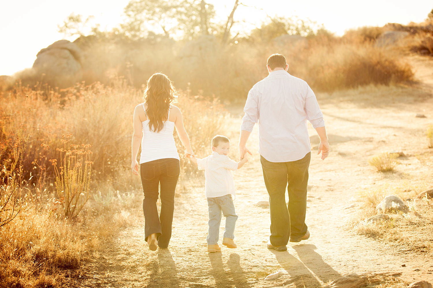 san diego family photography | family walking away with little boy looking back