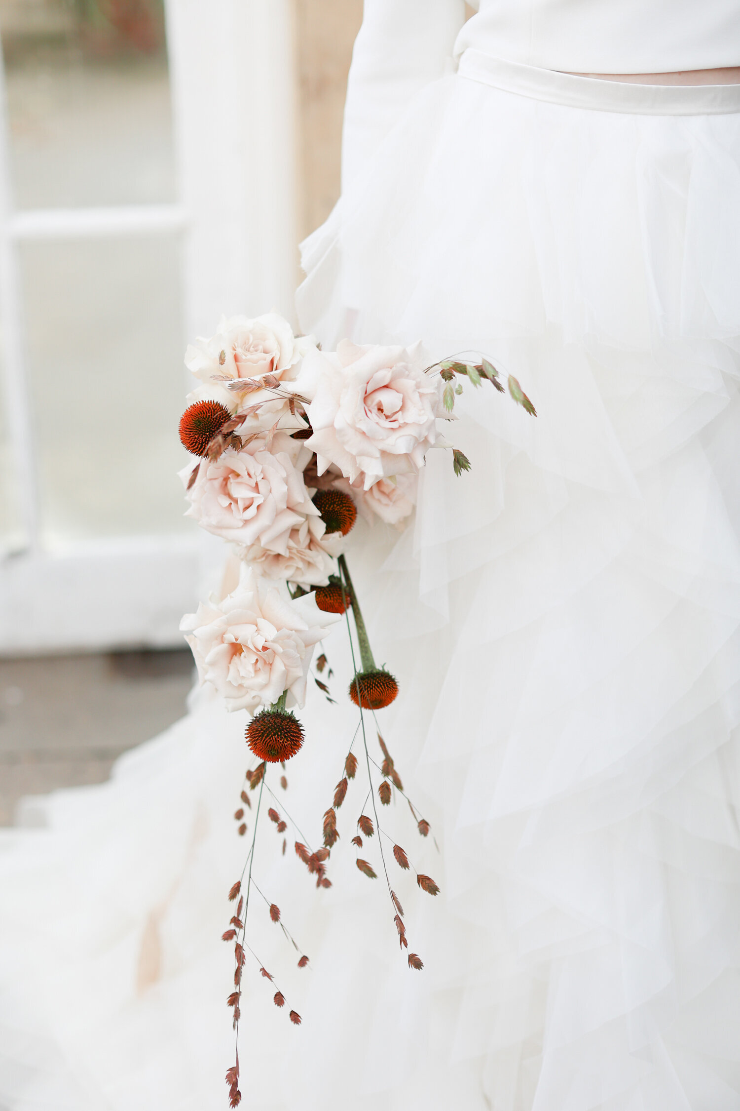 bride-holding-small-bouquet-of-flowers