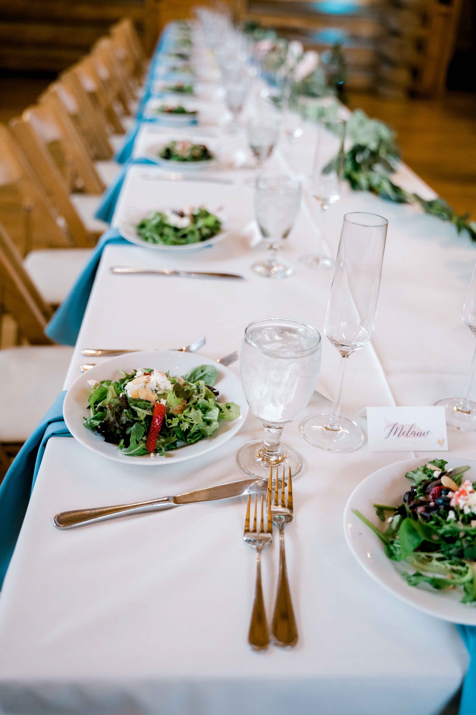 Clean looking table with salad on the plates