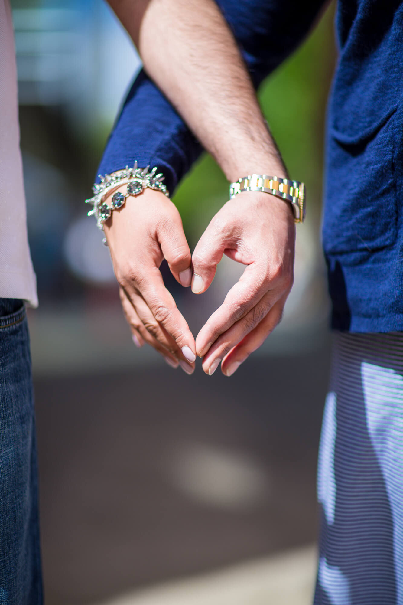 Engagement couple's  hands together forming a heart