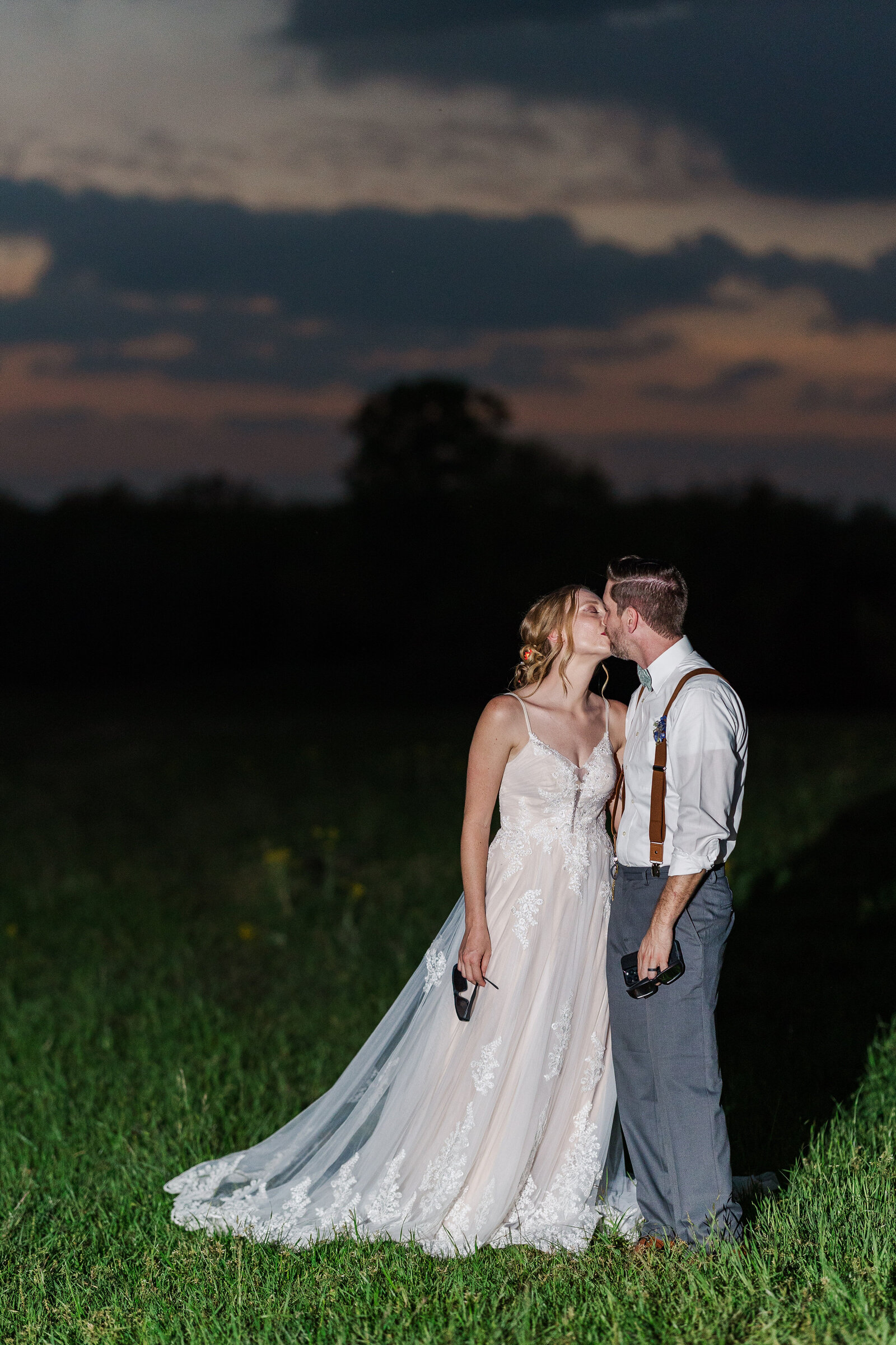 Bride-and-groom-kiss-under-full-eclipse