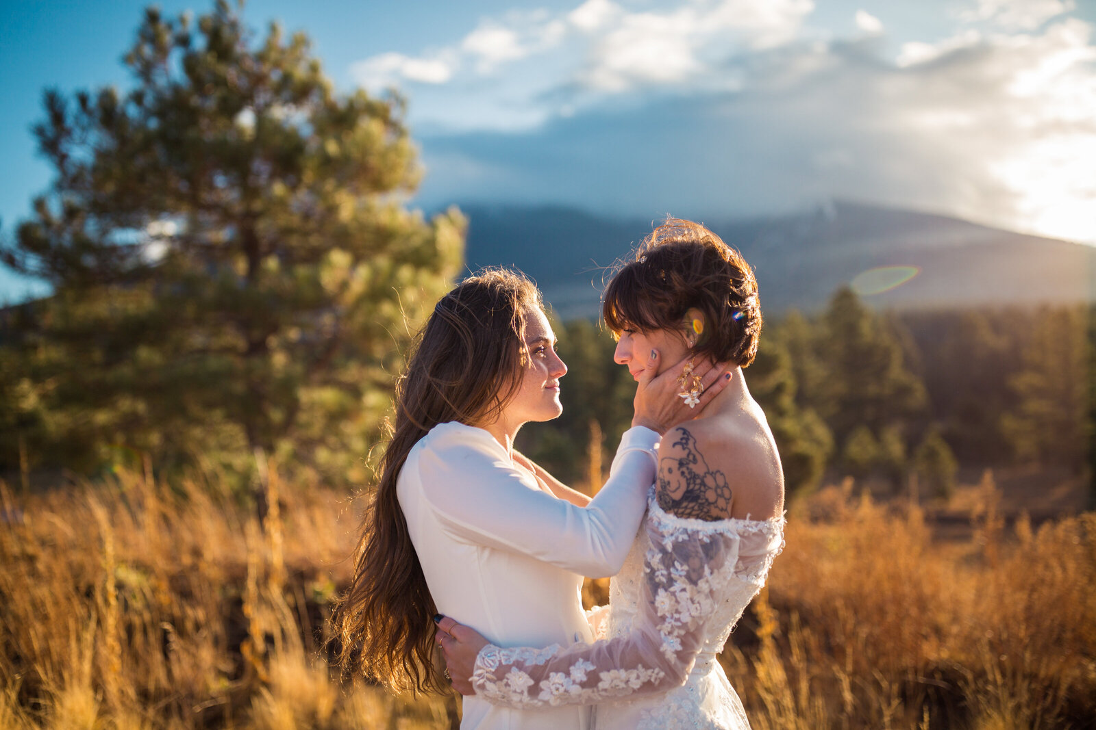 brides in long sleeve dresses at winter elopement