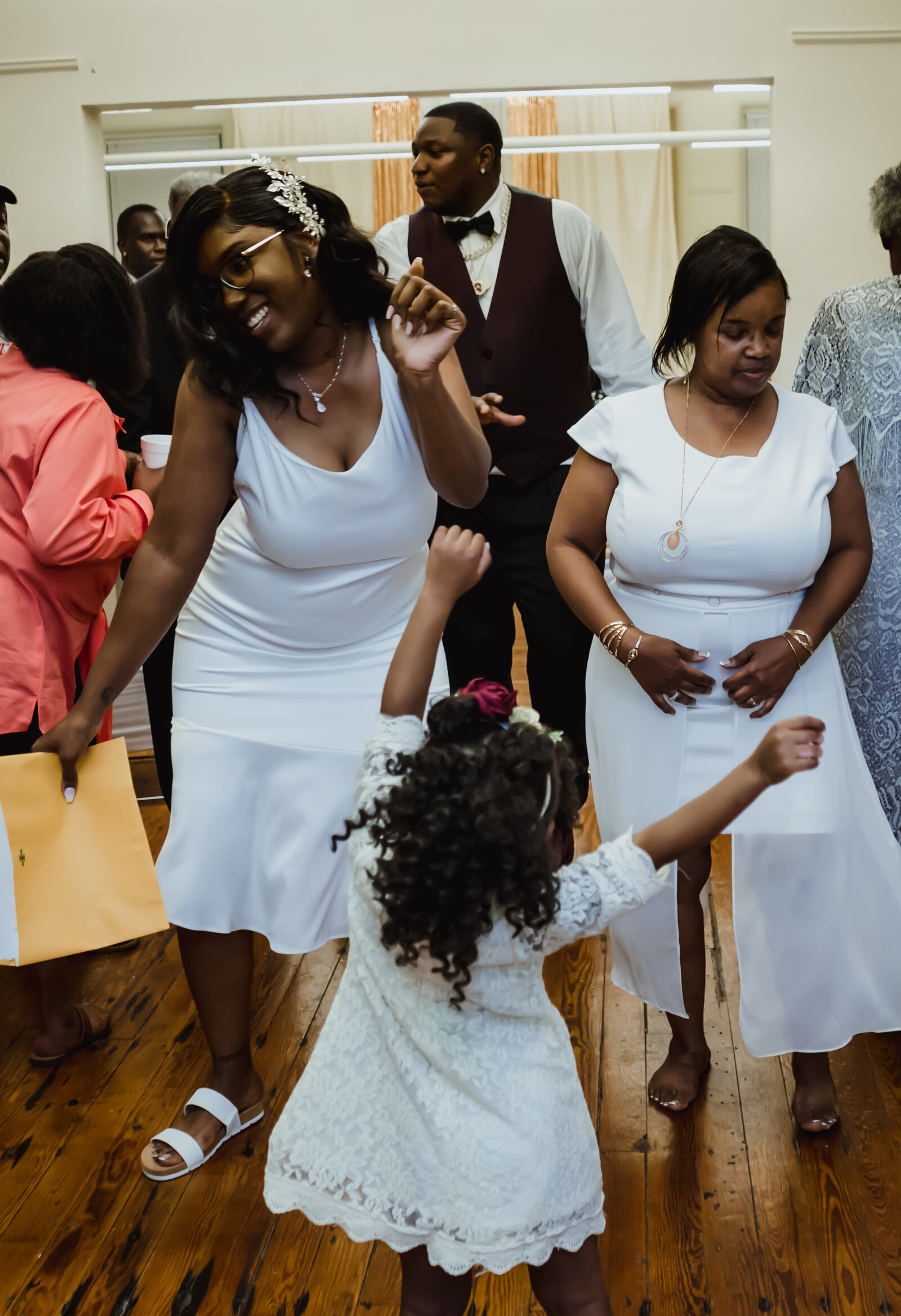 mother and daughter dance at a reception