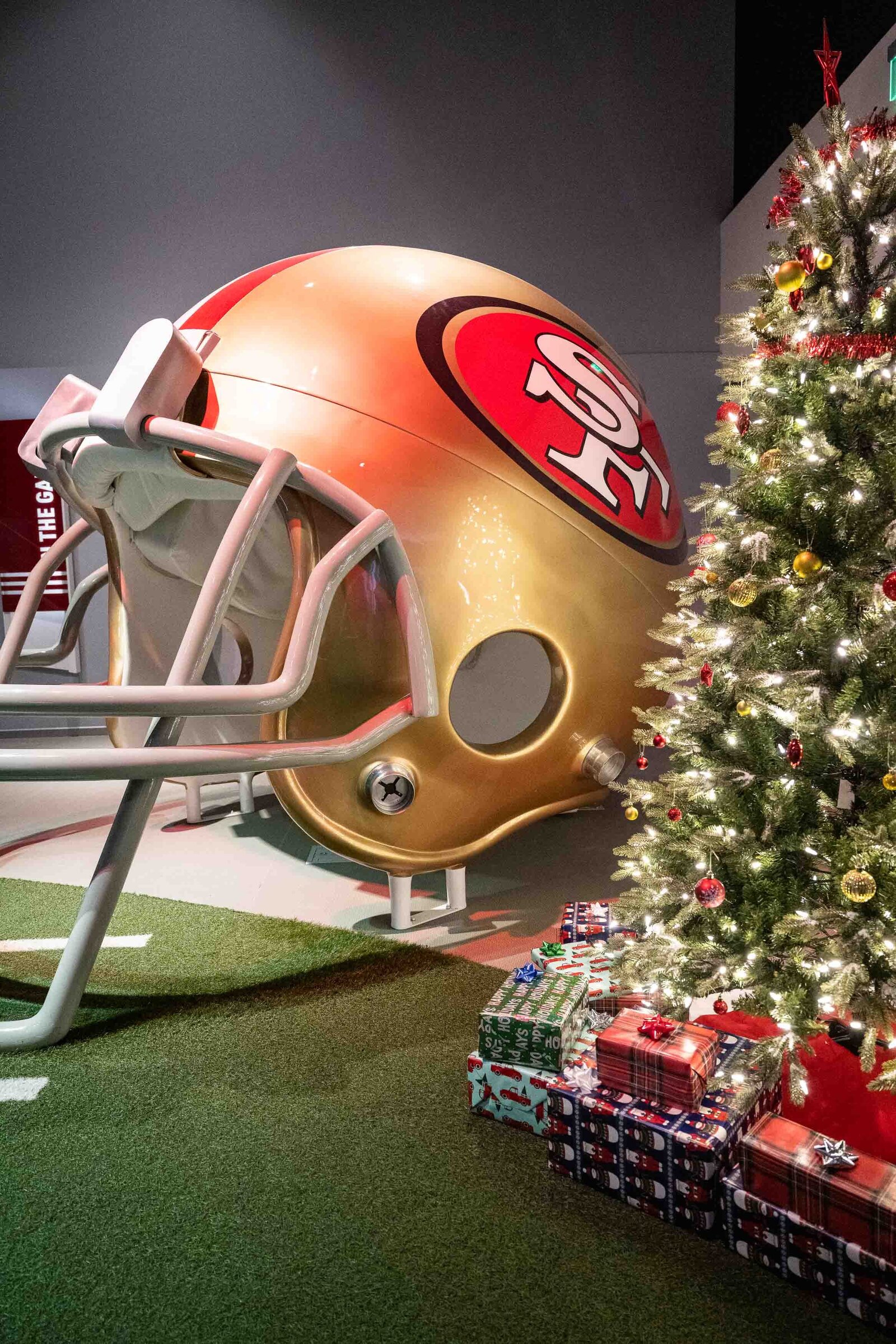 Holiday party Christmas tree and San Francisco 49ers helmet.-