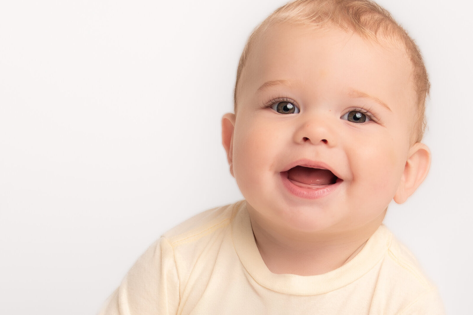 young baby smiling for school picture
