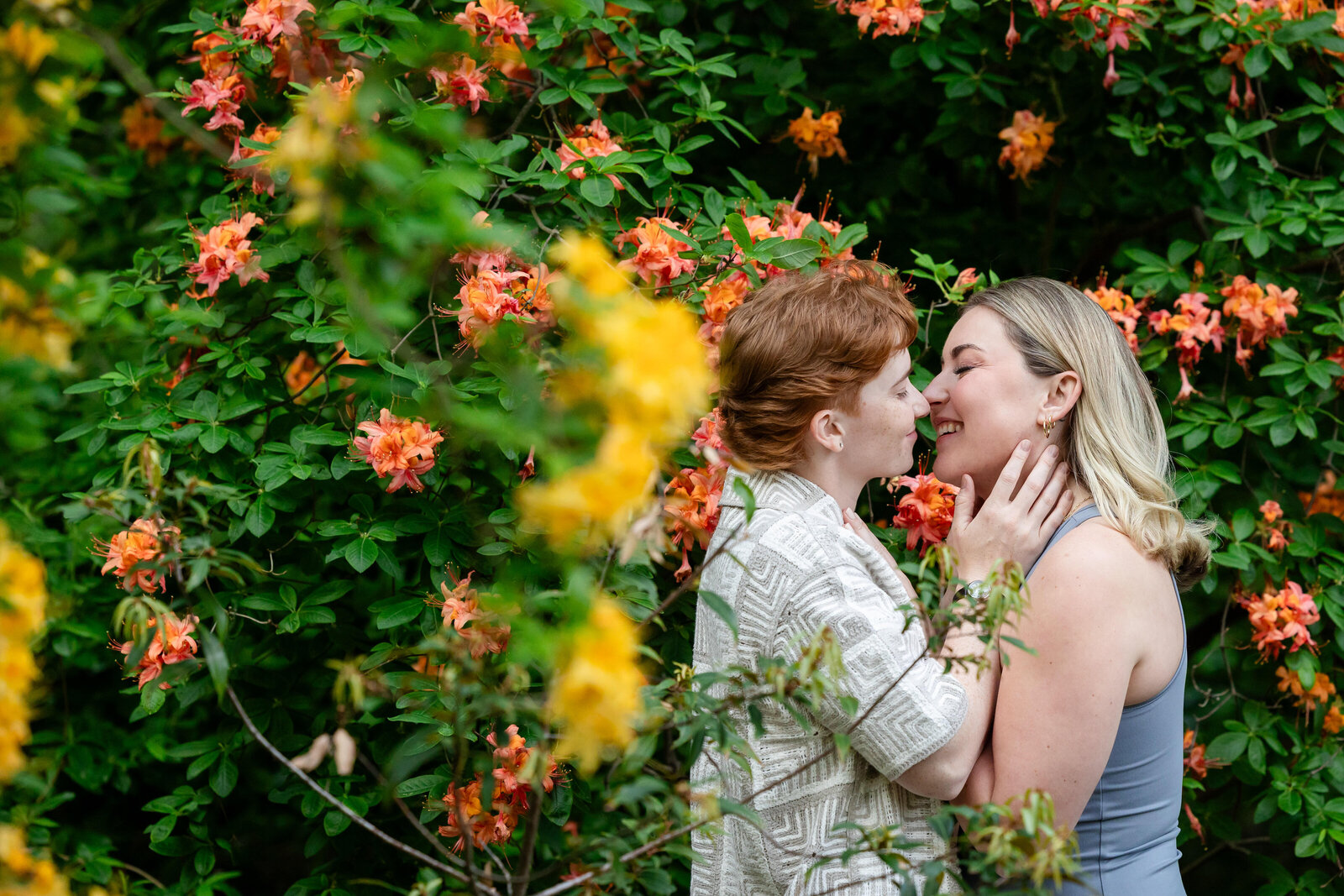 lesbian-gay-couple-engagement-flowers-lisa-gilbert-photography