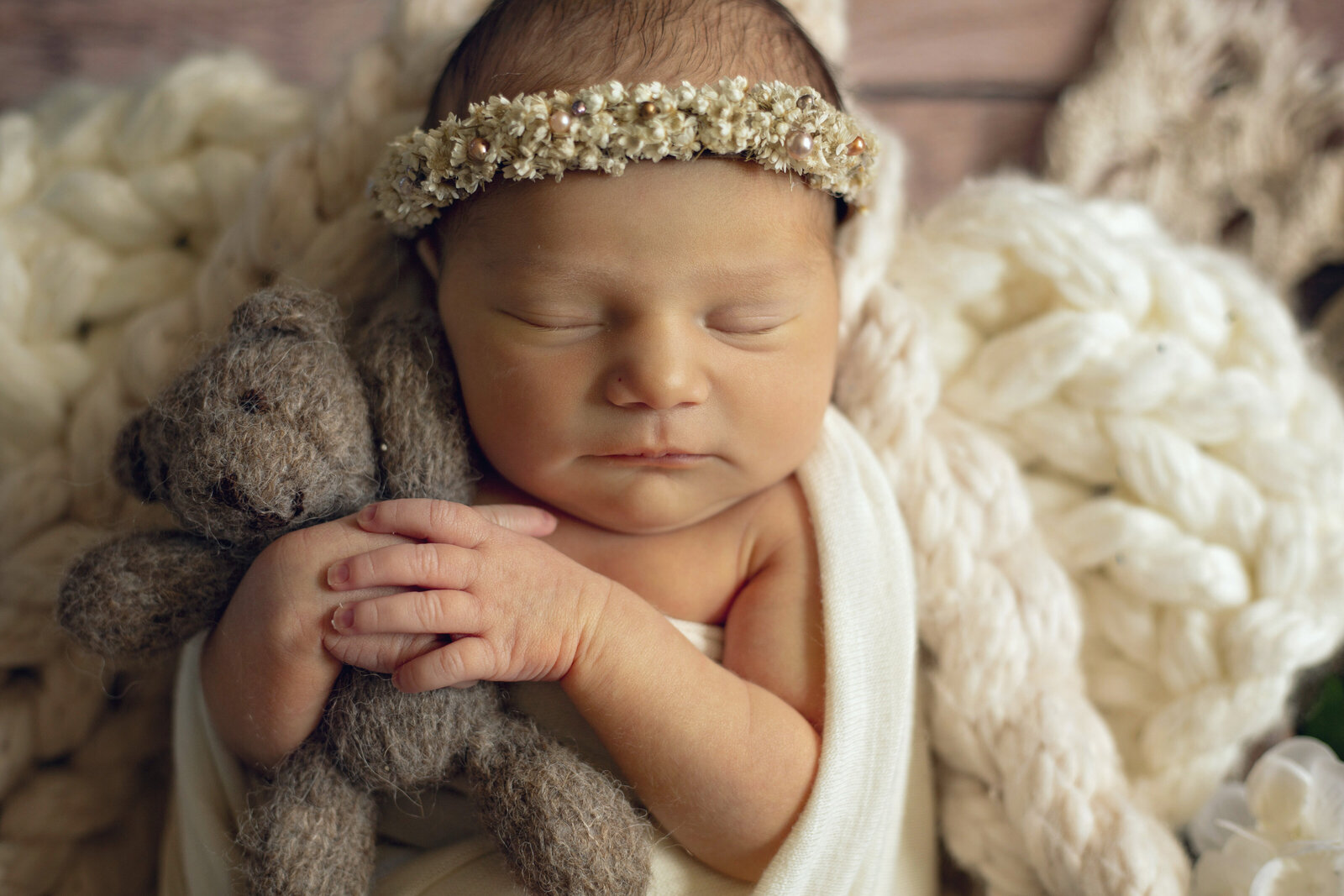 Baby-girl-with-a-floral-crown-and-a-teddy-bear
