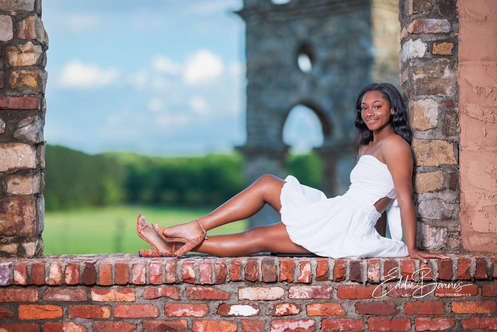 Girl sitting in white dress