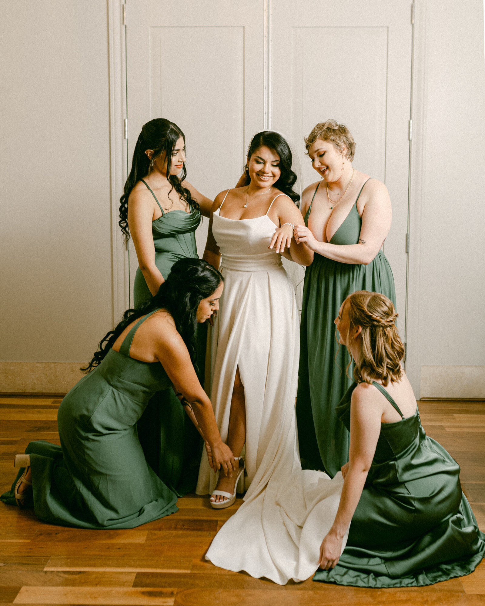 Bridesmaids help Fort Worth Bride get ready for her wedding in a Renaissance style photo