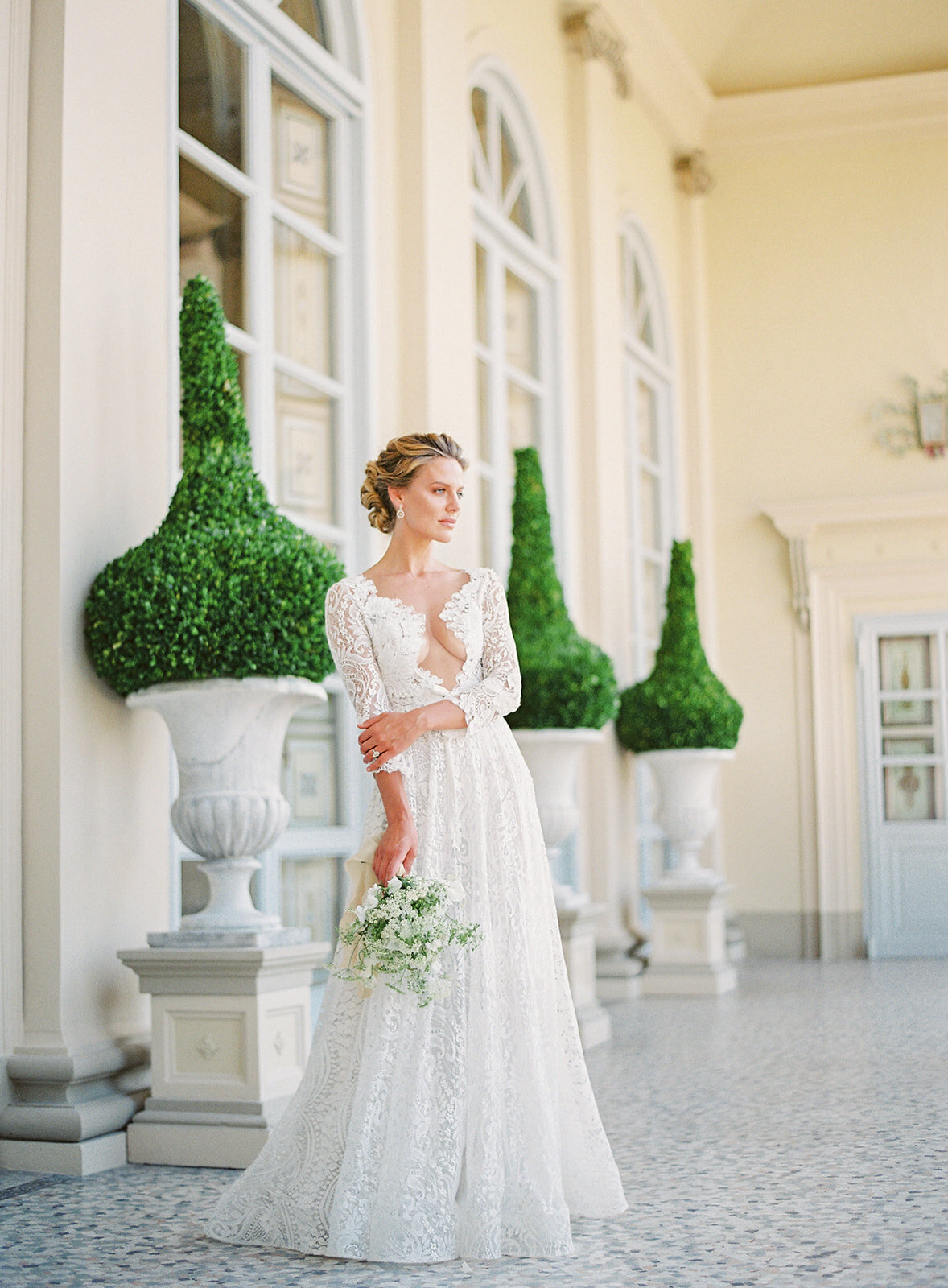 Bride on the veranda of the villa. Photographed by Amy Mulder Photography