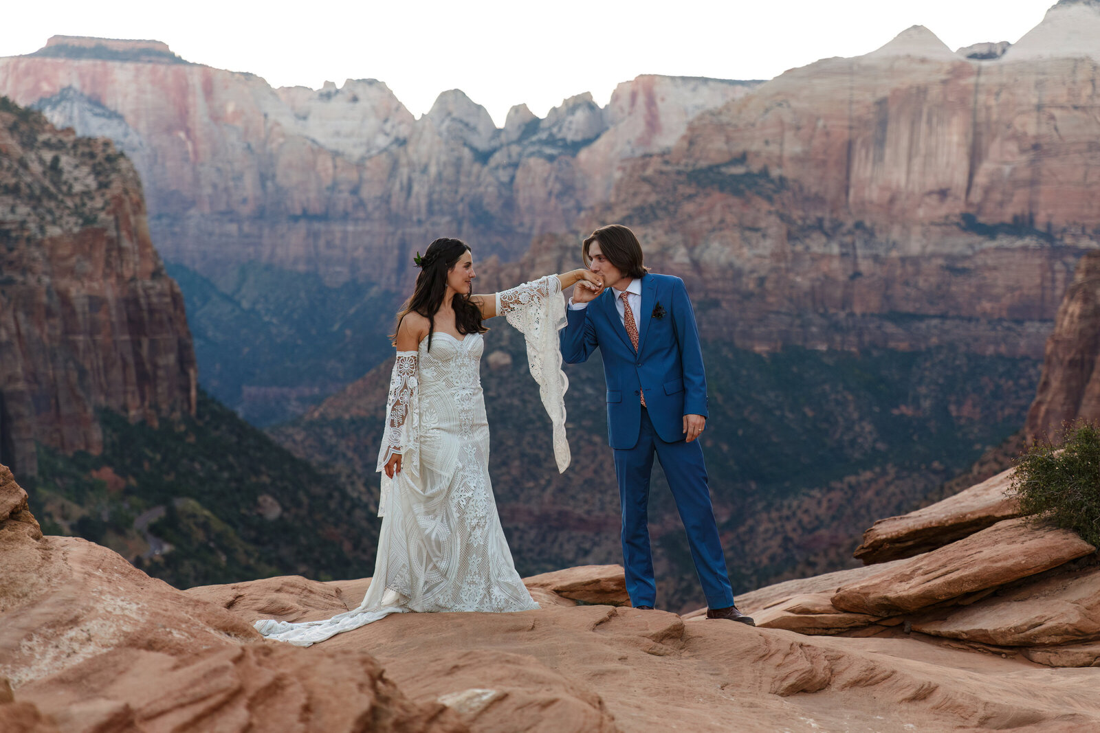 wedding couple on a cliff overlook in zion
