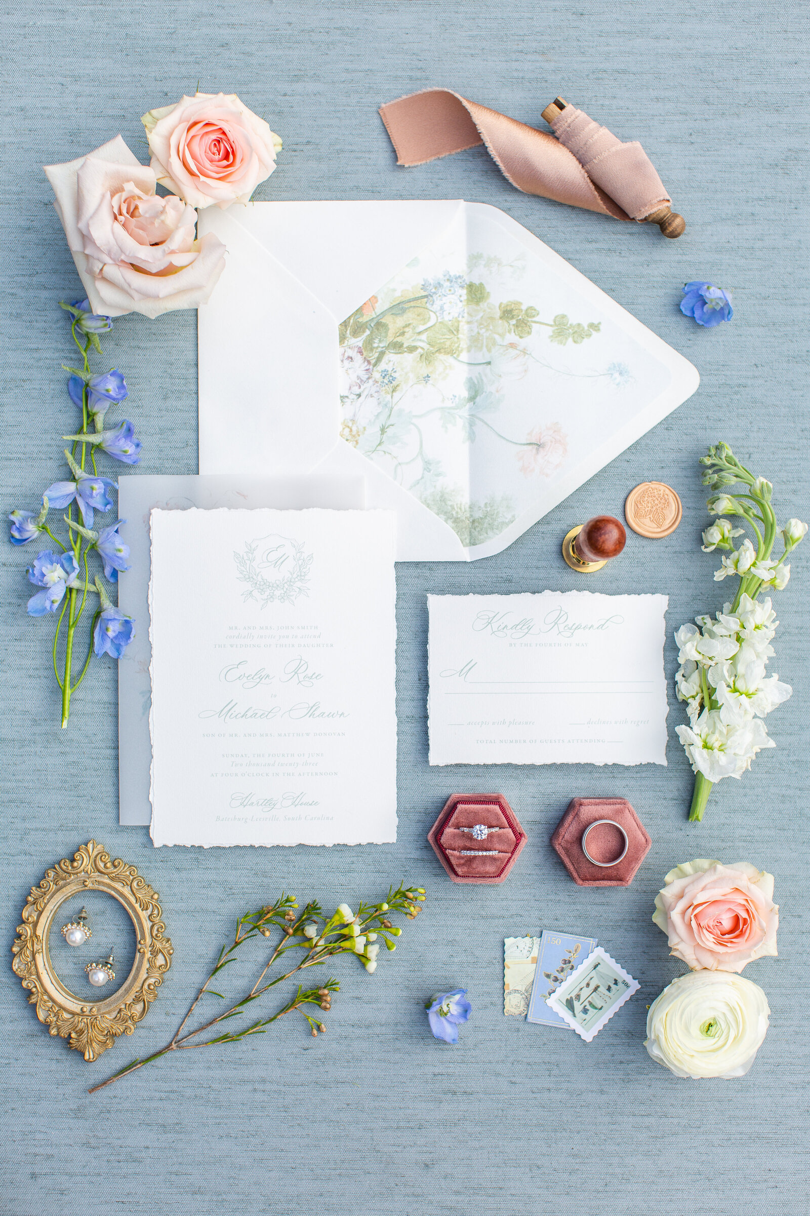 flat lay of wedding invitations and other wedding details