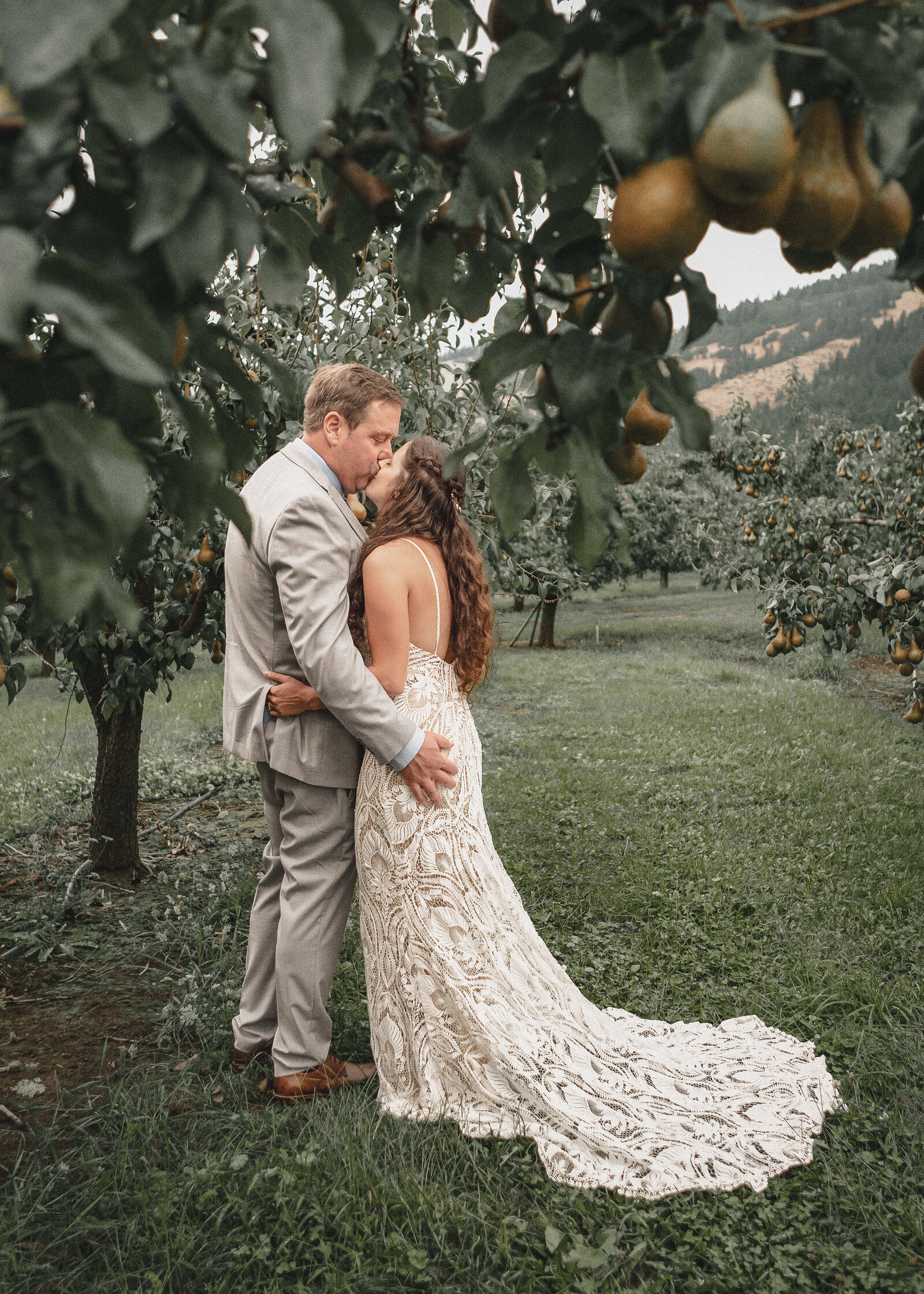 Couple getting some alone time in the orchard below The Crag Rat Hut in Hood River Oregon