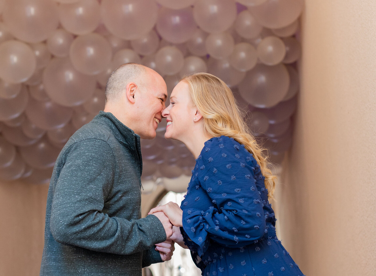 happy couple under balloons