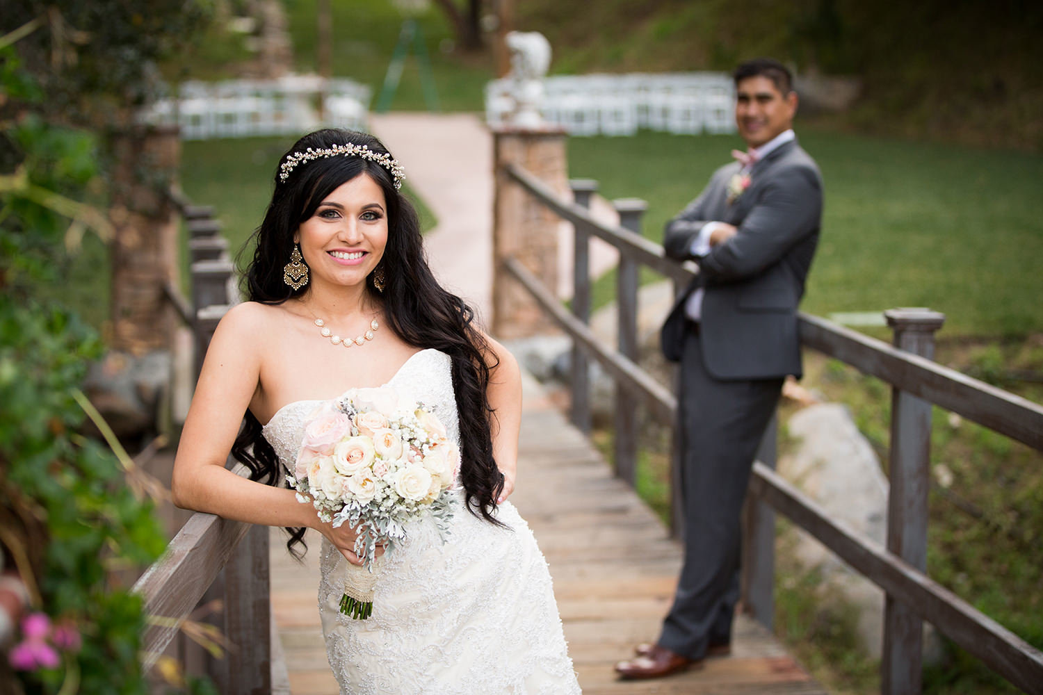 bride and groom on bridge with bride and groom