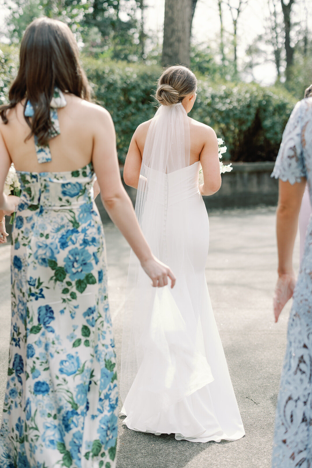 Bridesmaid Holding Brides Veil