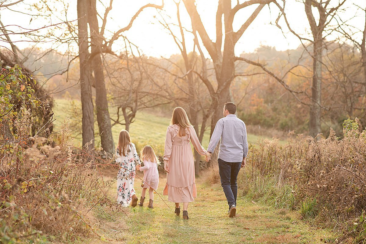Family walking away at sunset outdoors by Maryland Maternity Photographer : Rebecca Leigh Photography