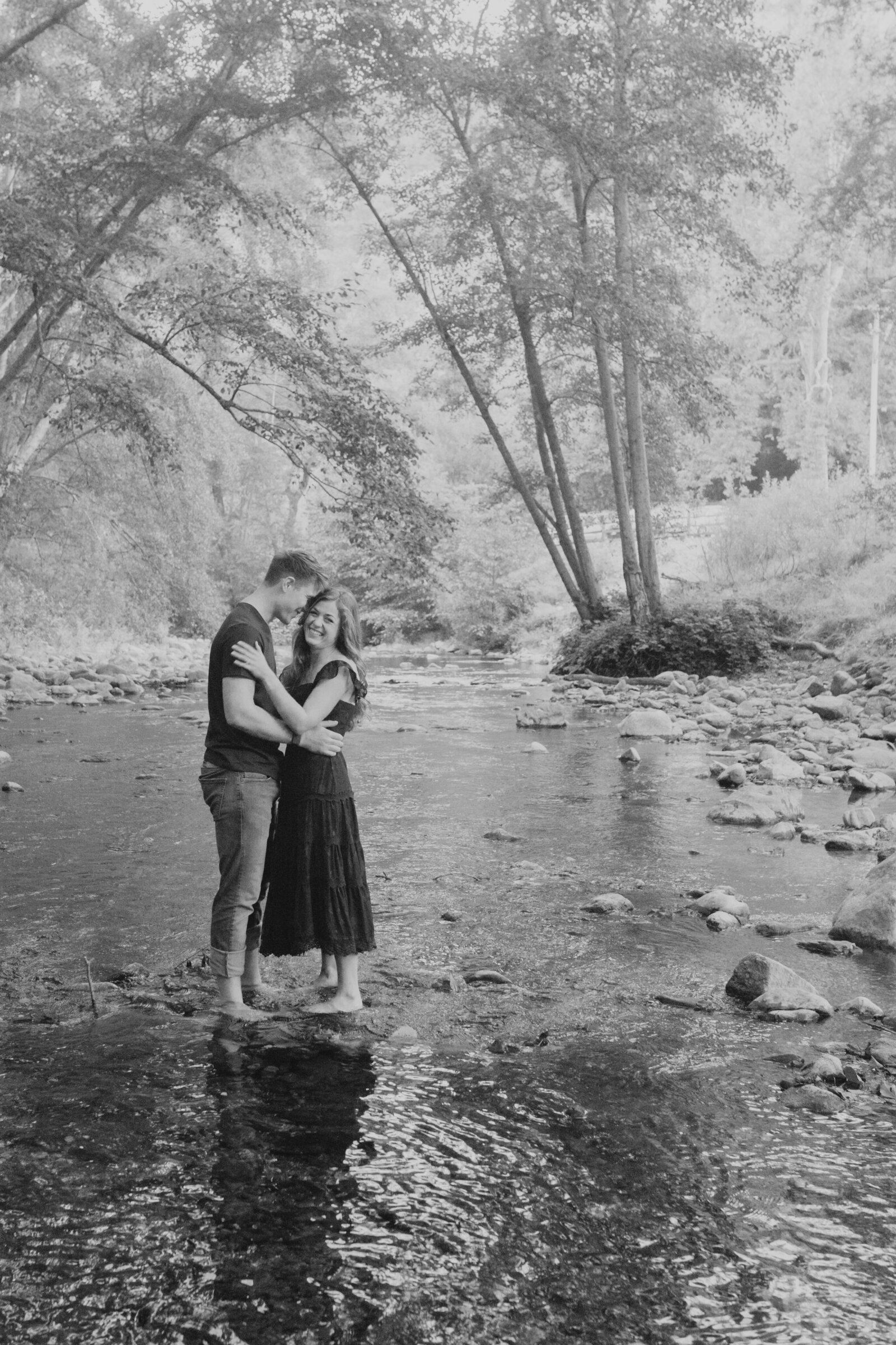 A couple poses for their engagement photos in Big Sur, California.
