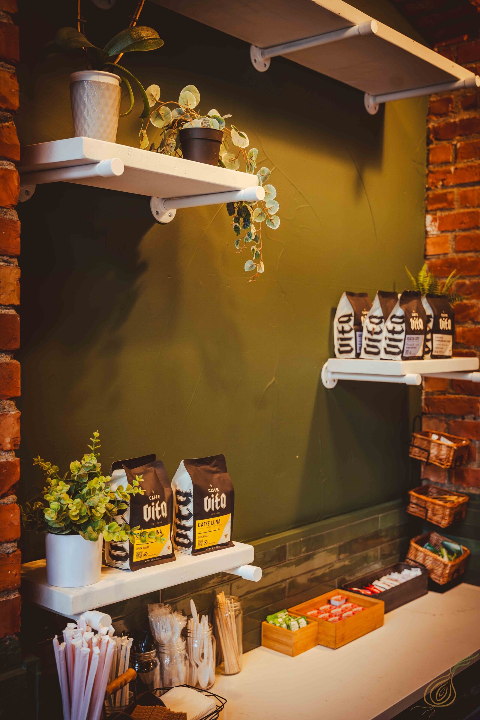 A shelf displaying an assortment of coffee products alongside various other items, showcasing diverse selections.
