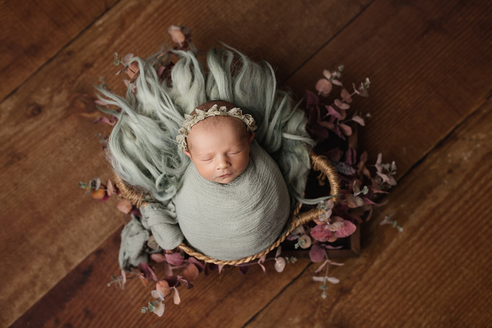 sage green fur wrapped baby swaddle newborn andrea b photography llanelli