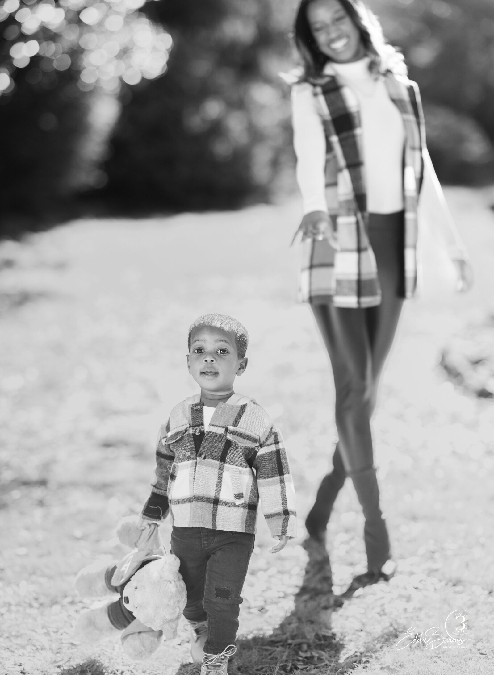 Mom walking behind son