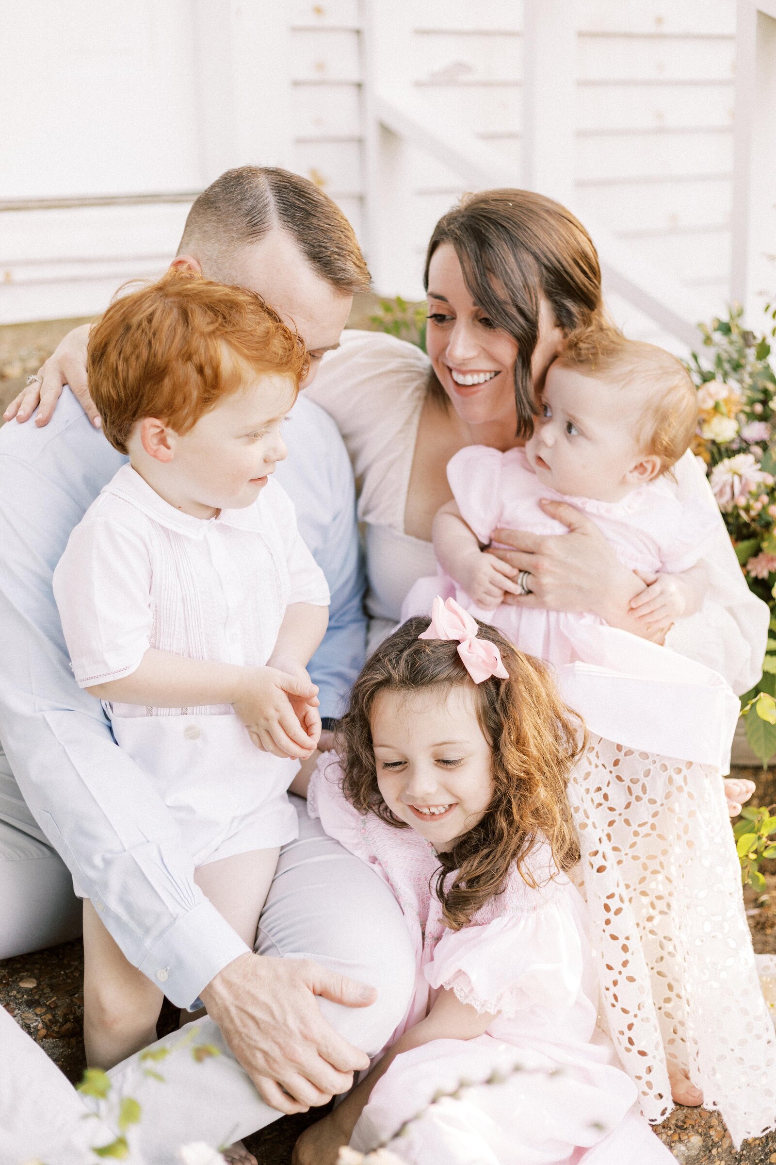family smiling and hugging during peoria illinois family photos 