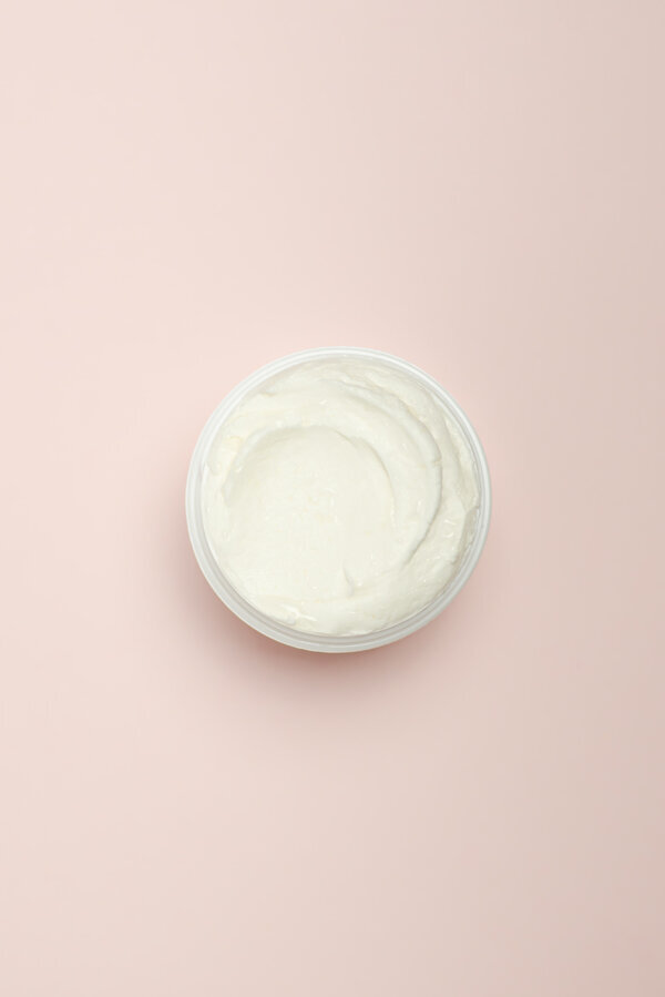 Facial cream on pink background
