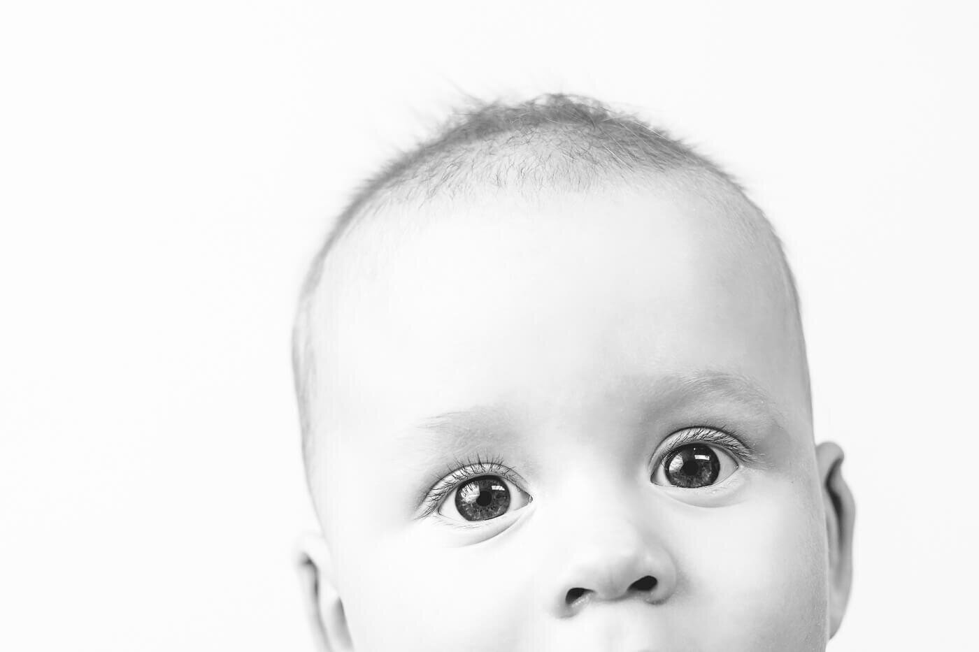 Half face perspective of baby with big eyes