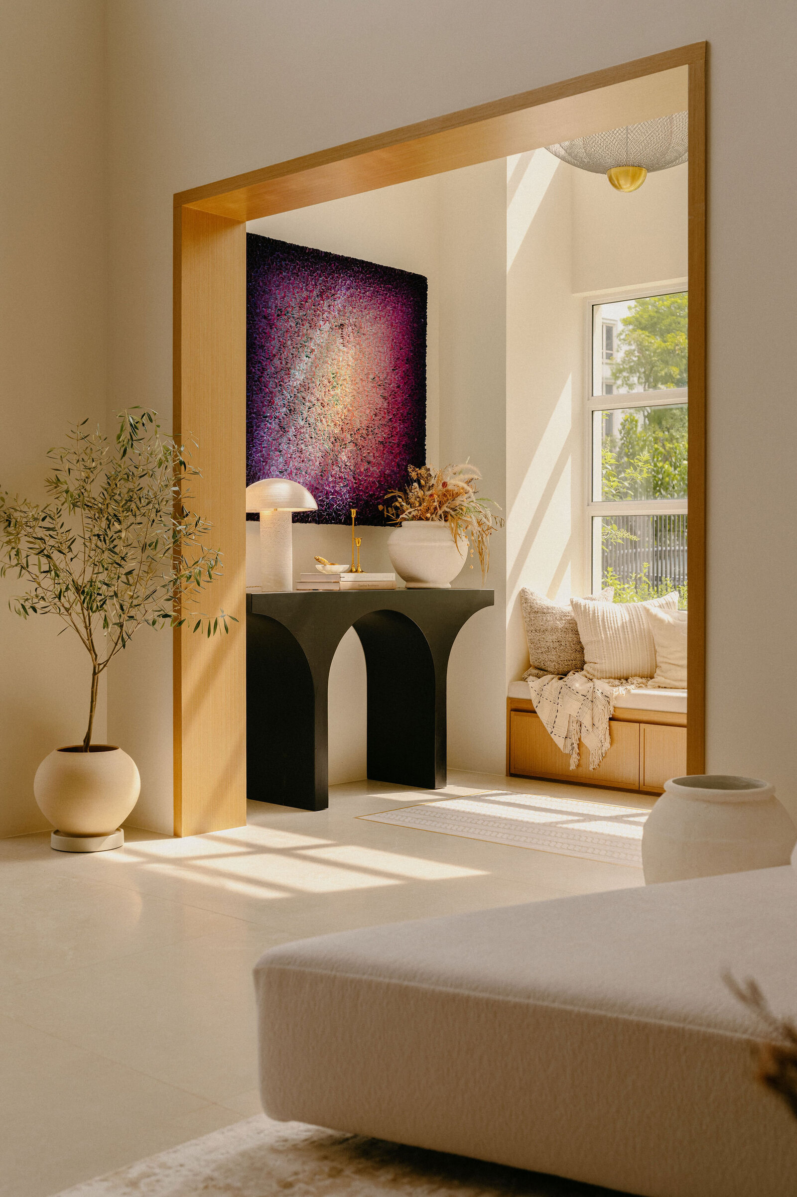 Living room entryway of a luxurious landed home in Singapore, cozy, sunlight interior design