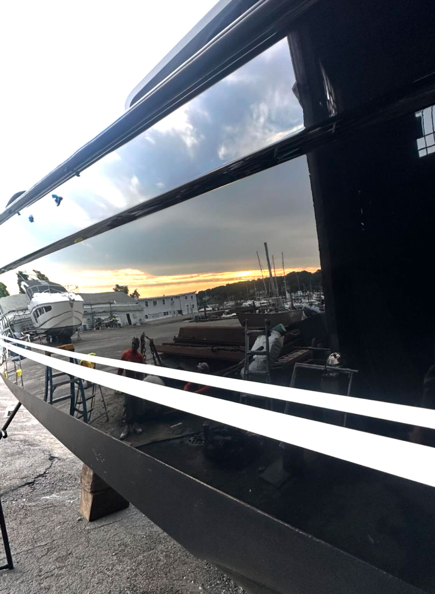 Reflection on a freshly detailed yacht exterior
