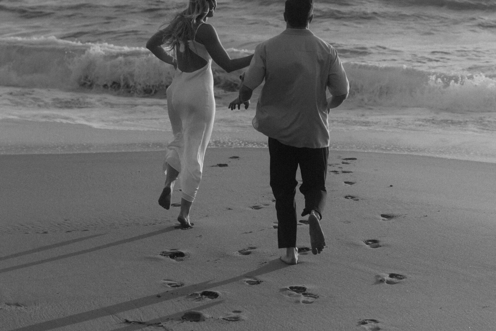 Couple running on Laguna Beach