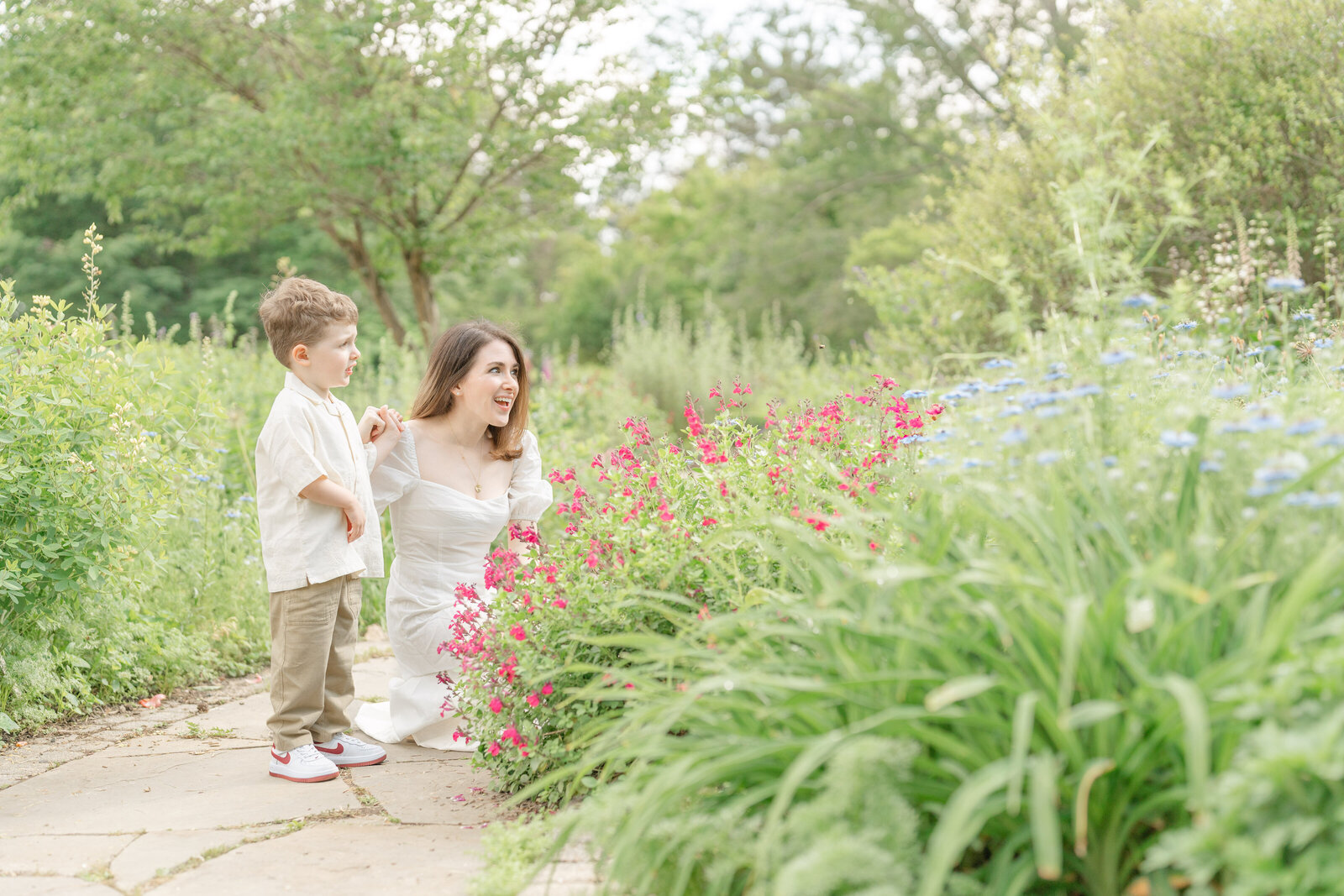 mom and son looking at flowers in Chantilly, Virginia