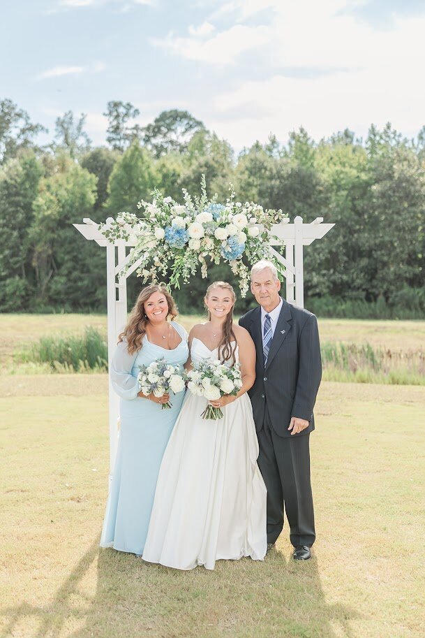 Mother-Father-Bride-Arbor-Blue-White-Flowers-The-Legacy-At-Willow-Pond