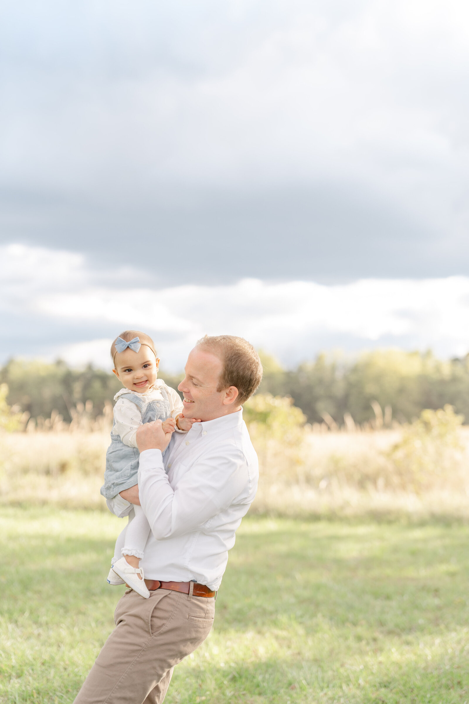 dad look at baby during Loudoun County, Virginia family photography