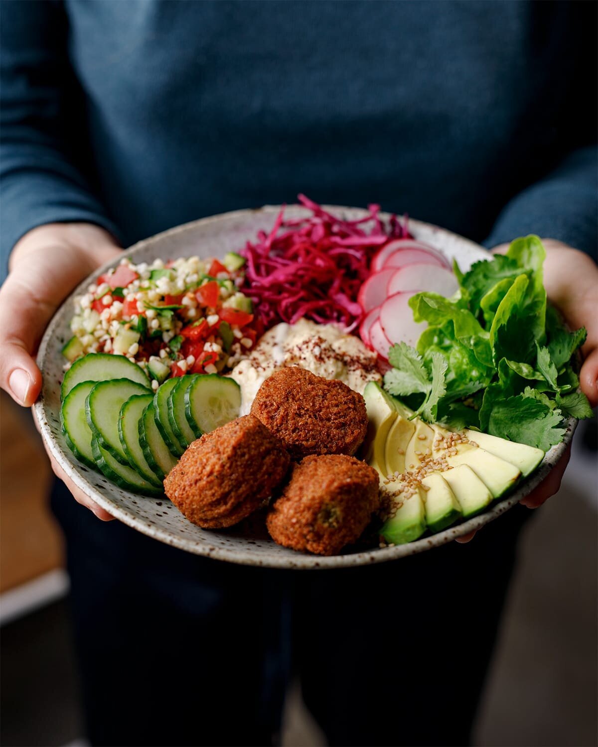 holding_falafel_bowl